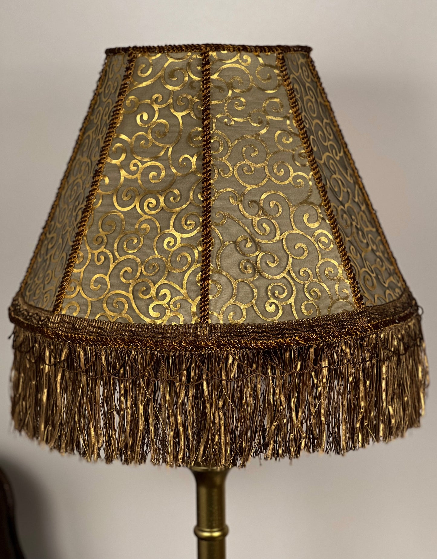 Lampshade. Luxurious Victorian fringed lampshade in brown and golden color