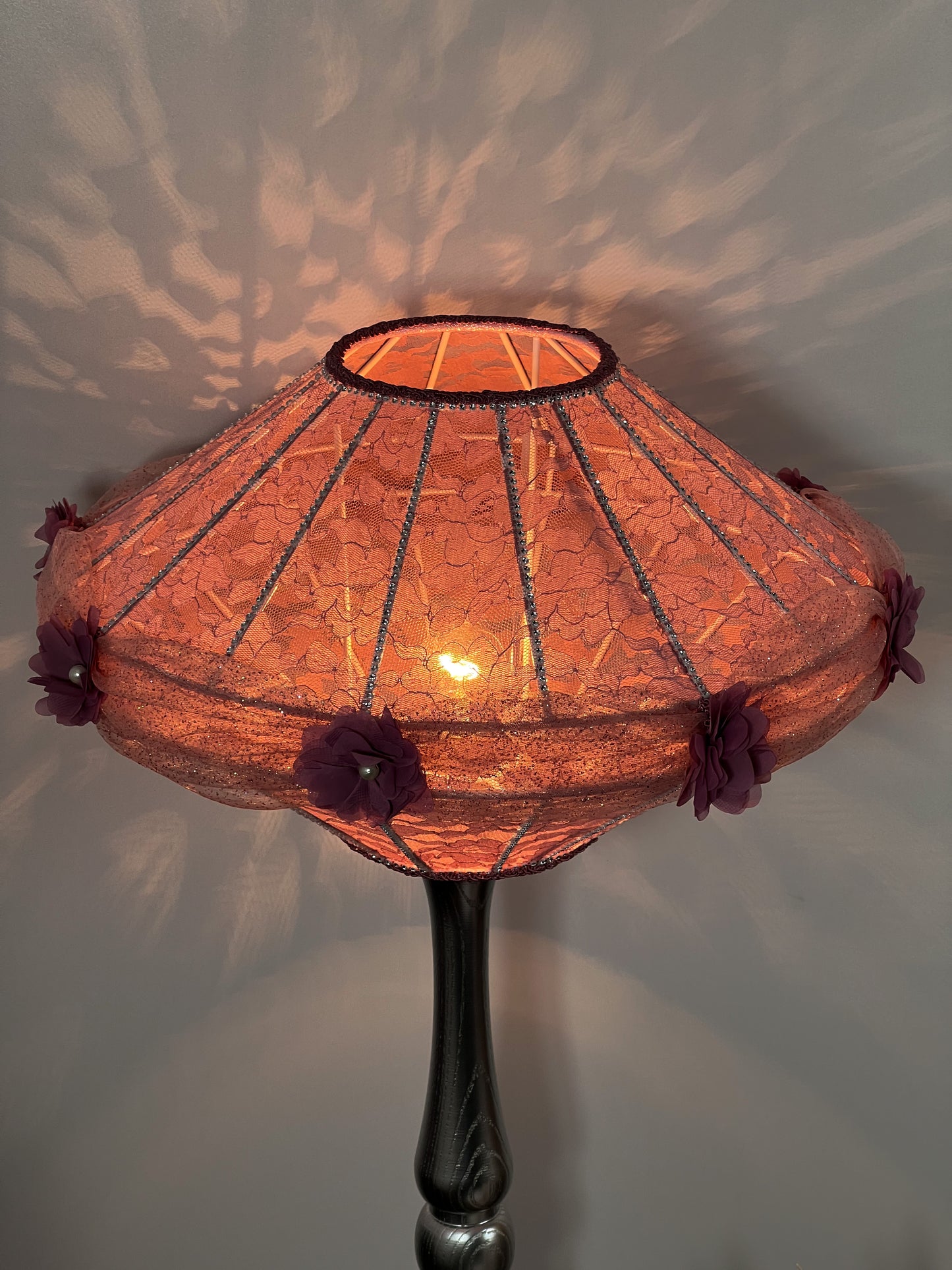 Victorian pink lampshade with floral design.