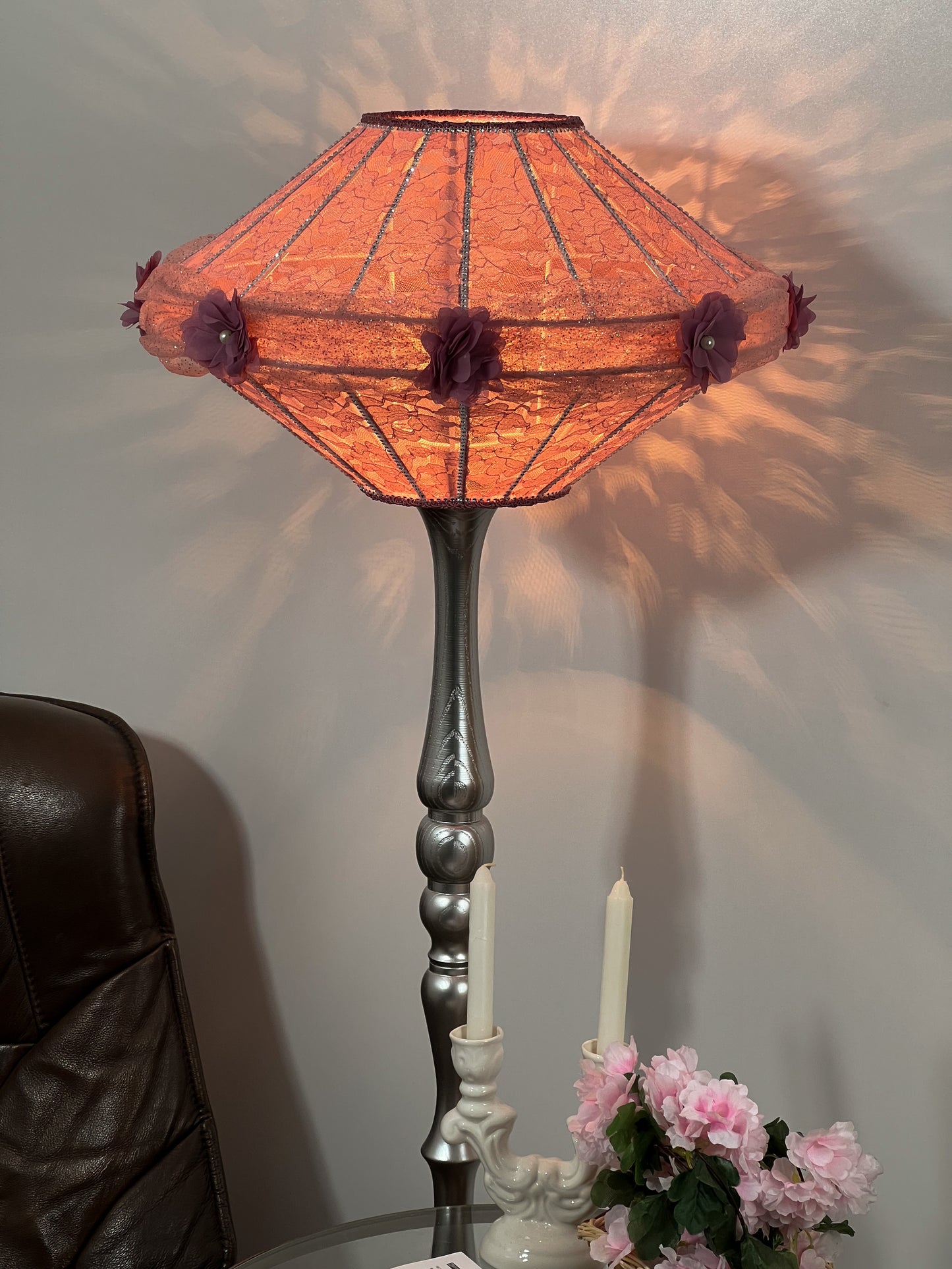 Victorian pink lampshade with floral design.