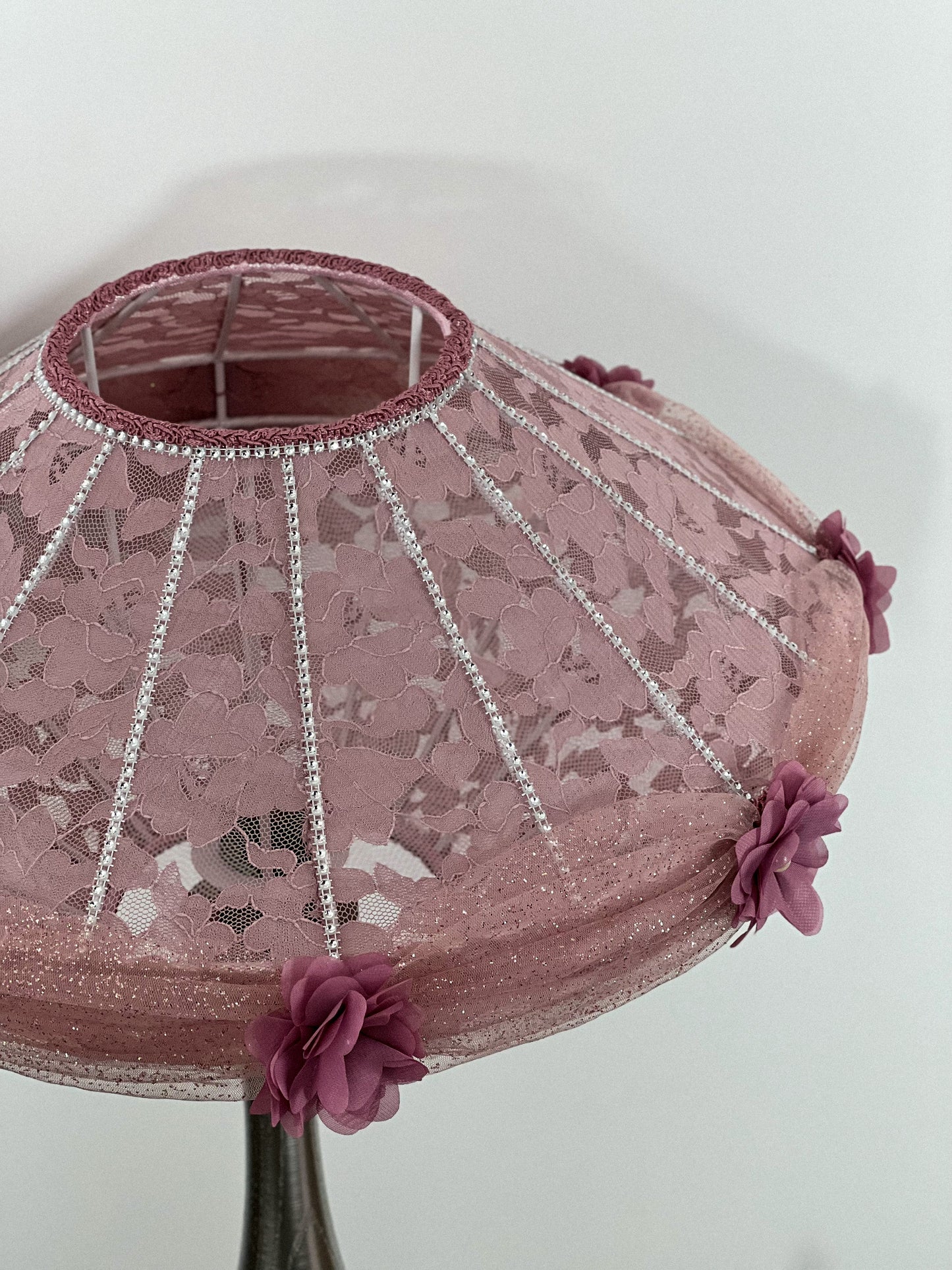 Victorian pink lampshade with floral design.