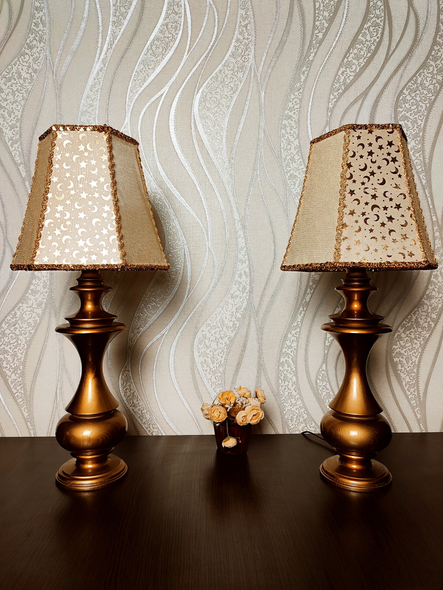 Table lamp. Golden celestial lamp with shimmering moons and stars on a delicate fabric. The wooden base is bronze in color. 7701