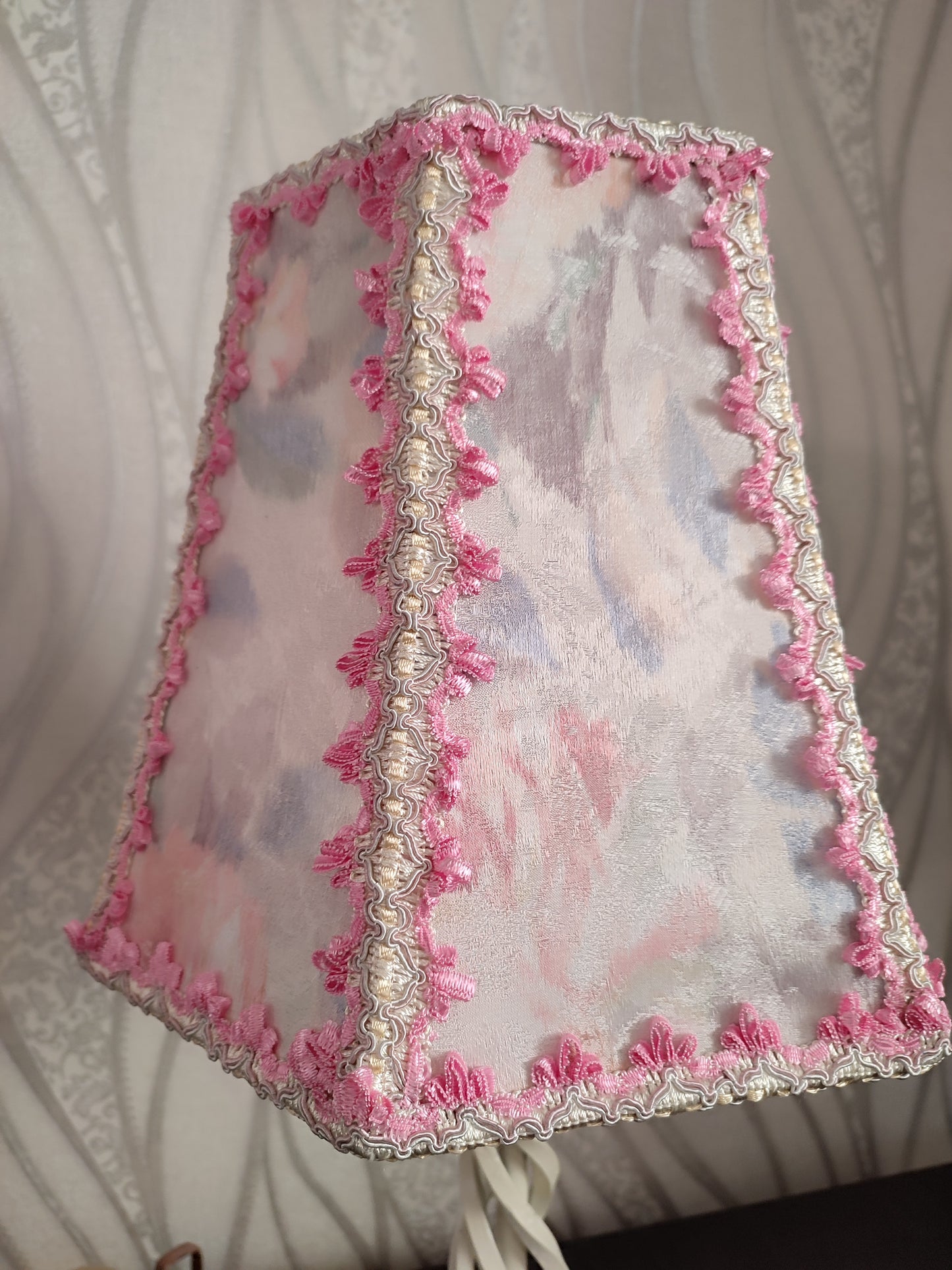 Table lamp. Pink table lamp with a wrought iron spiral base, a fabulous lamp. 7702