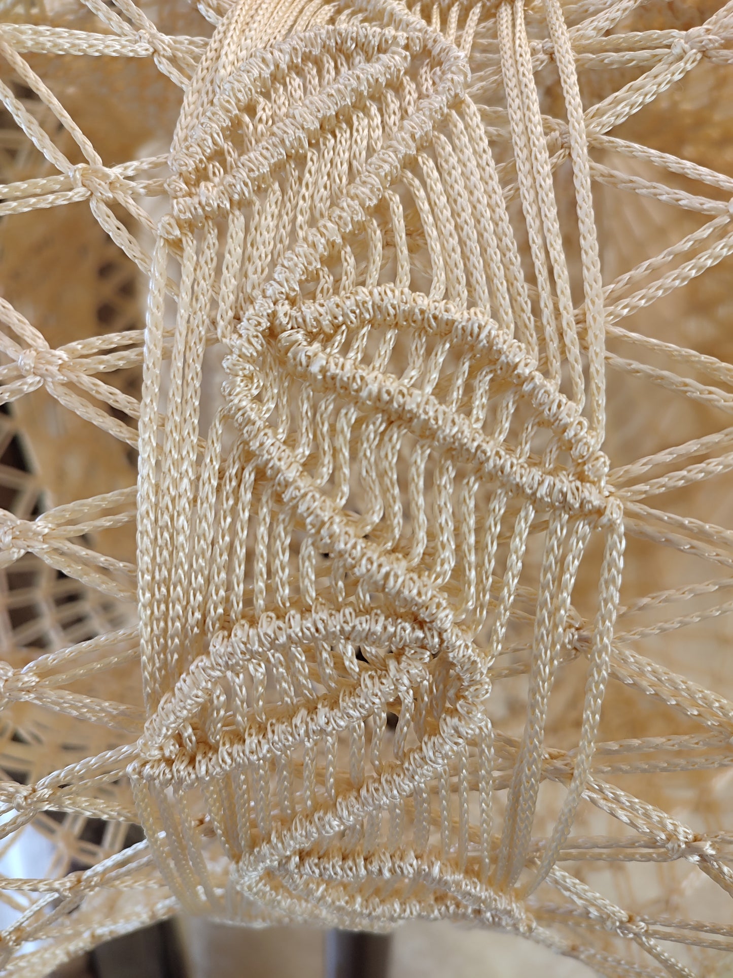 A unique macrame lampshade with a complex panel design. 2207