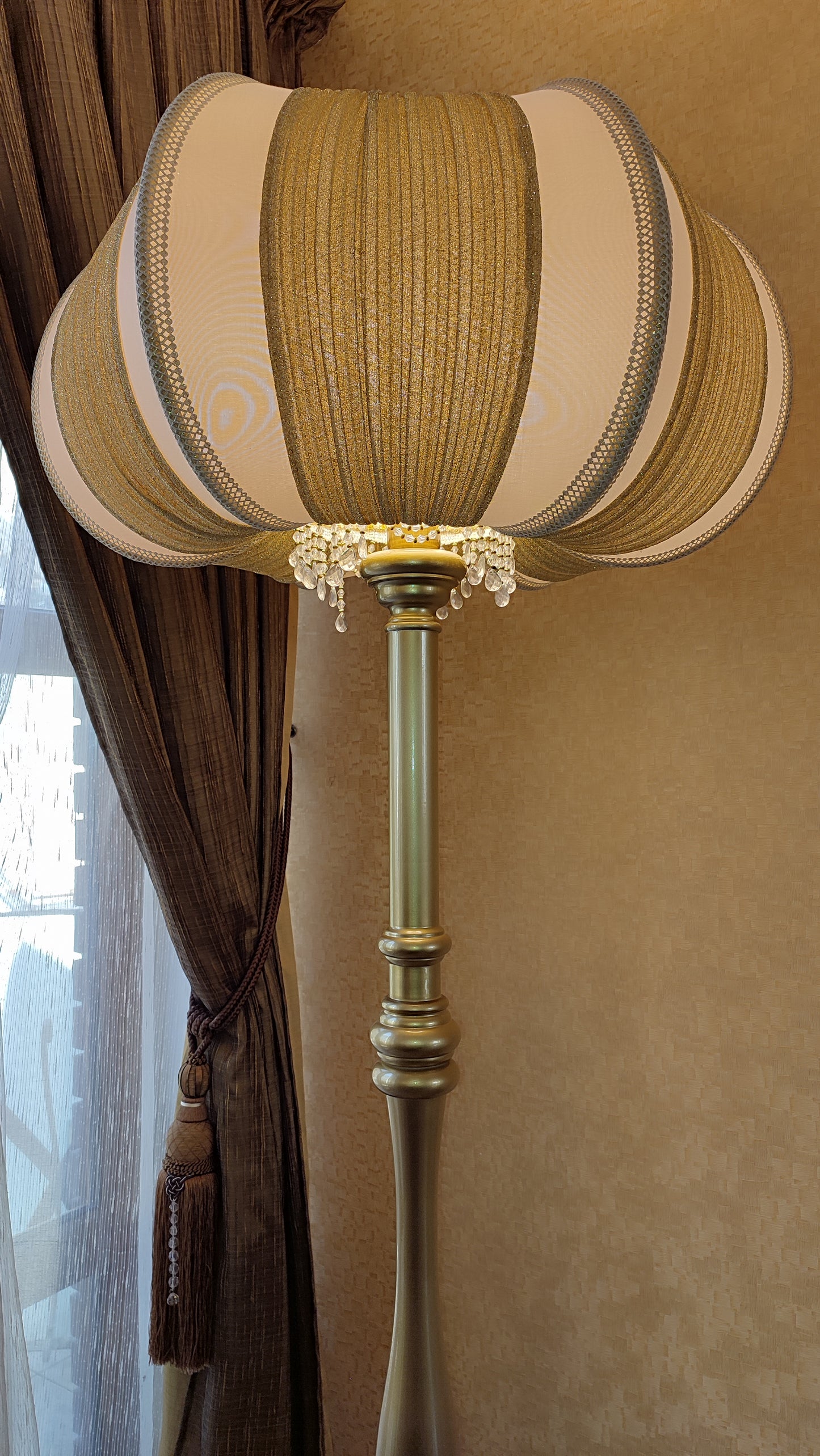 A two-tone creamy golden lampshade, delicate crystal beads and an elegant wooden base add a touch of luxurious radiance 2206
