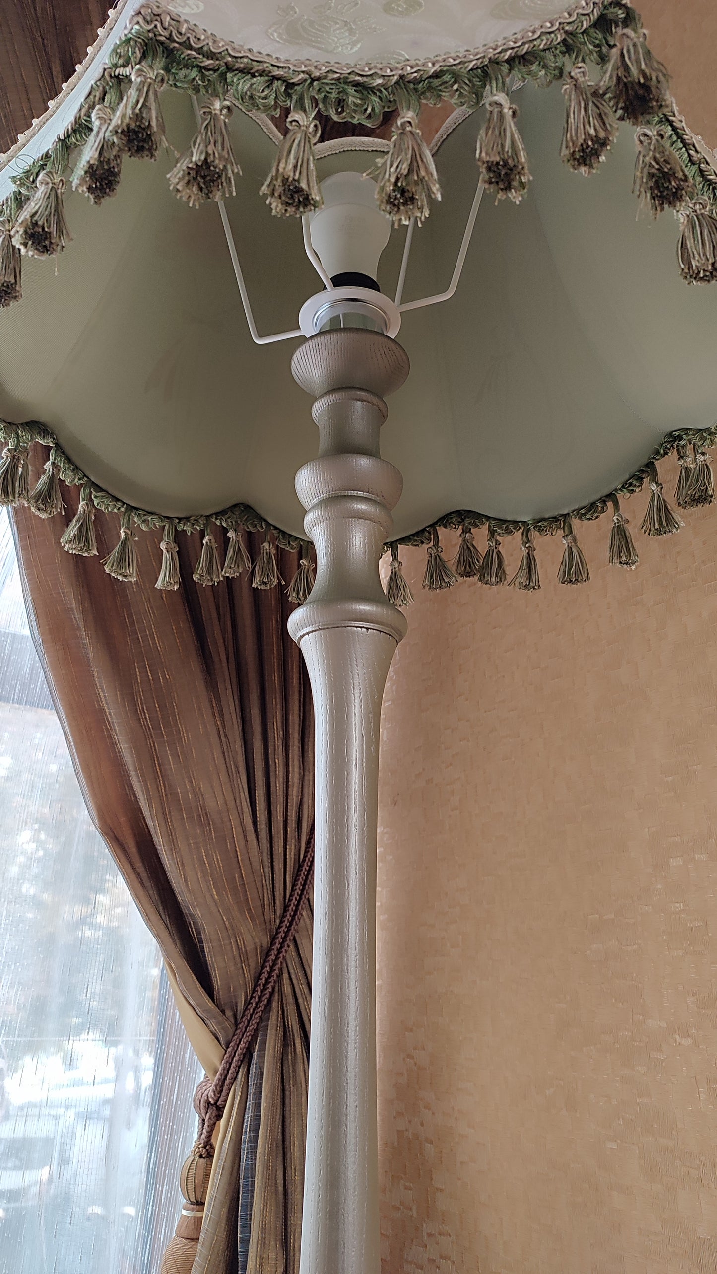 A Victorian floor lamp with a fabric shade and an exquisite floral umbrella motif with tassels. 3705