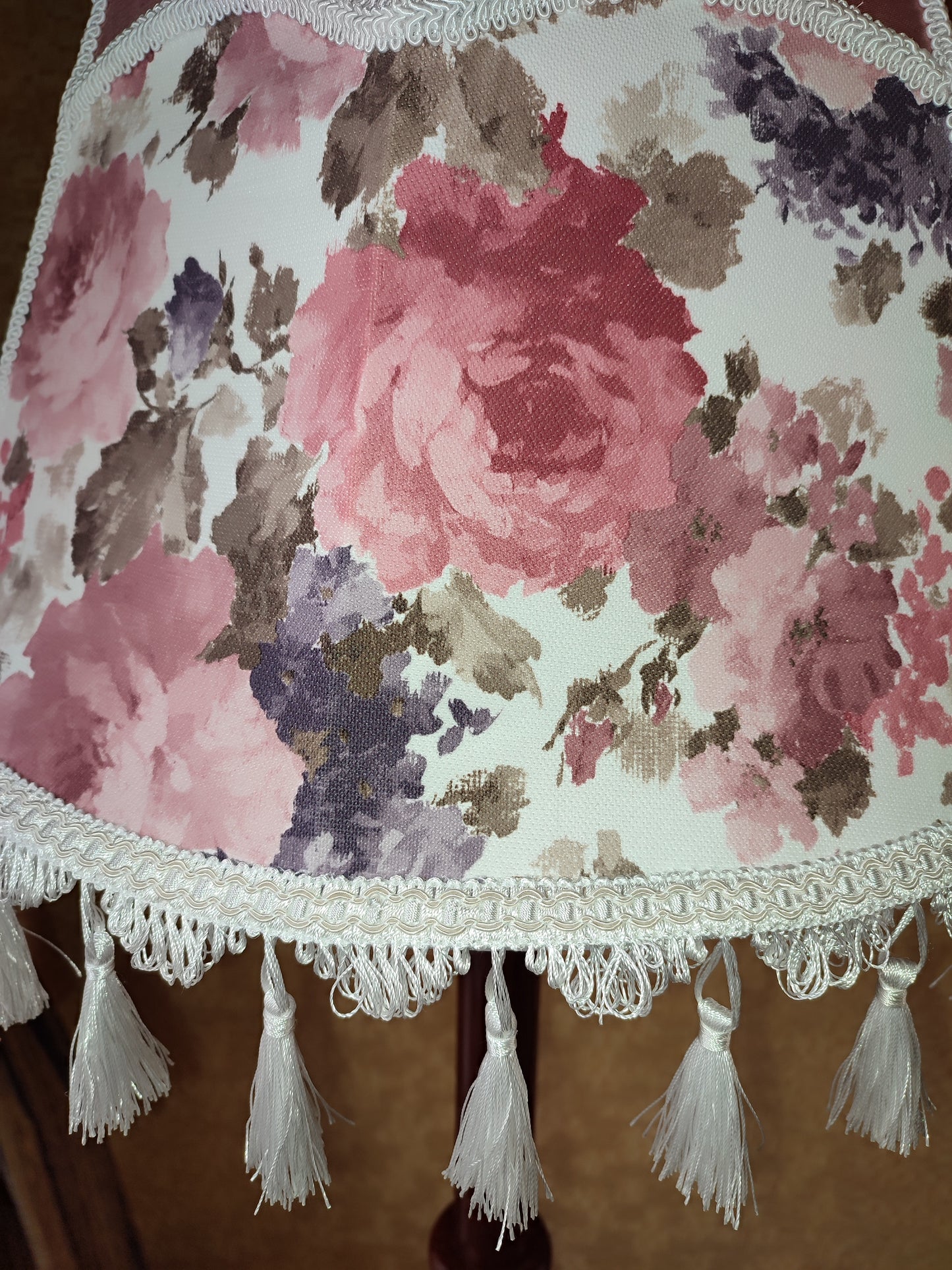 Floor lamp, pastel pink top, blooming flower shade, delicate fringe with tassels, on an elegant wooden base. 3601