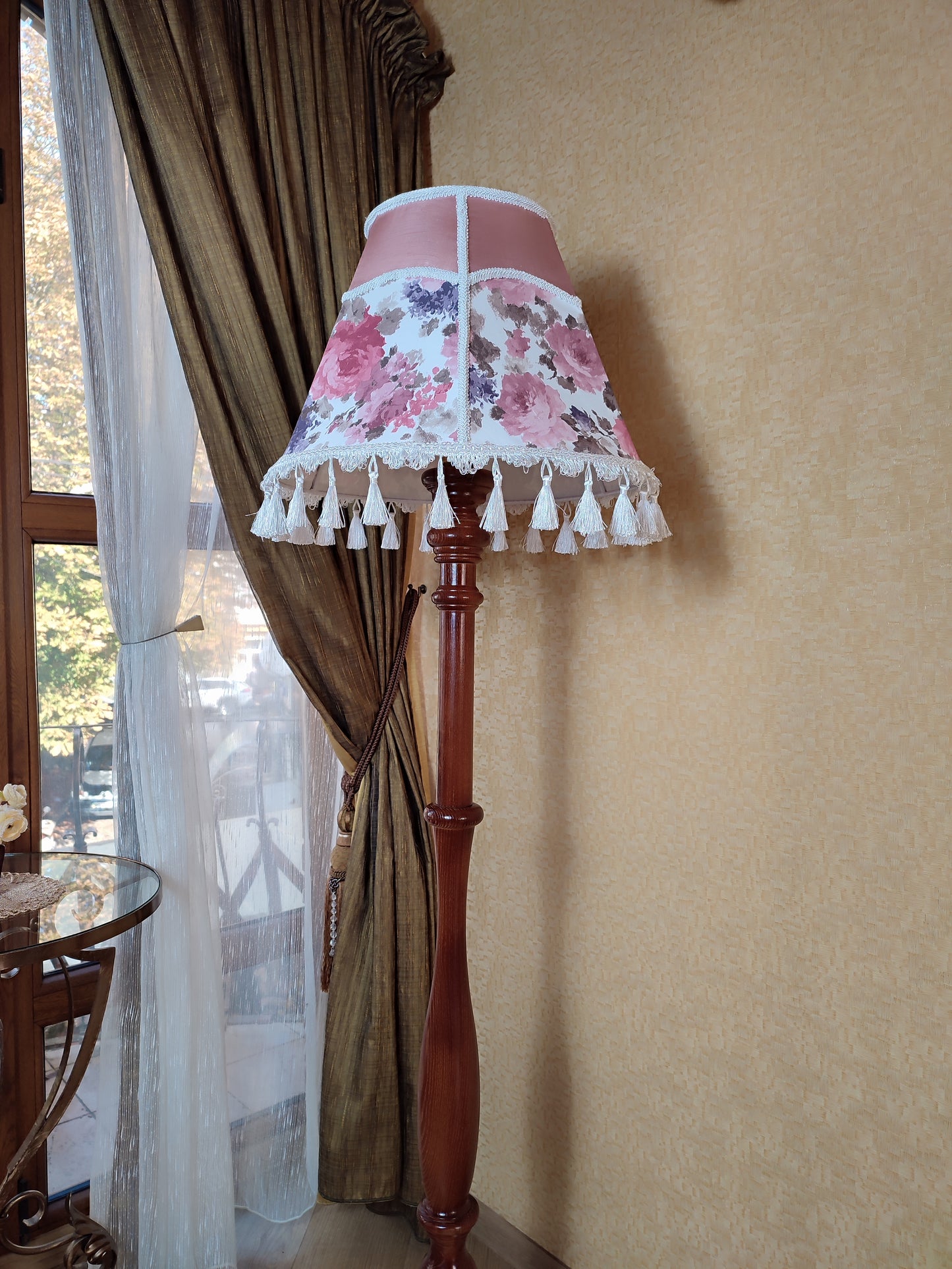 Floor lamp, pastel pink top, blooming flower shade, delicate fringe with tassels, on an elegant wooden base. 3601