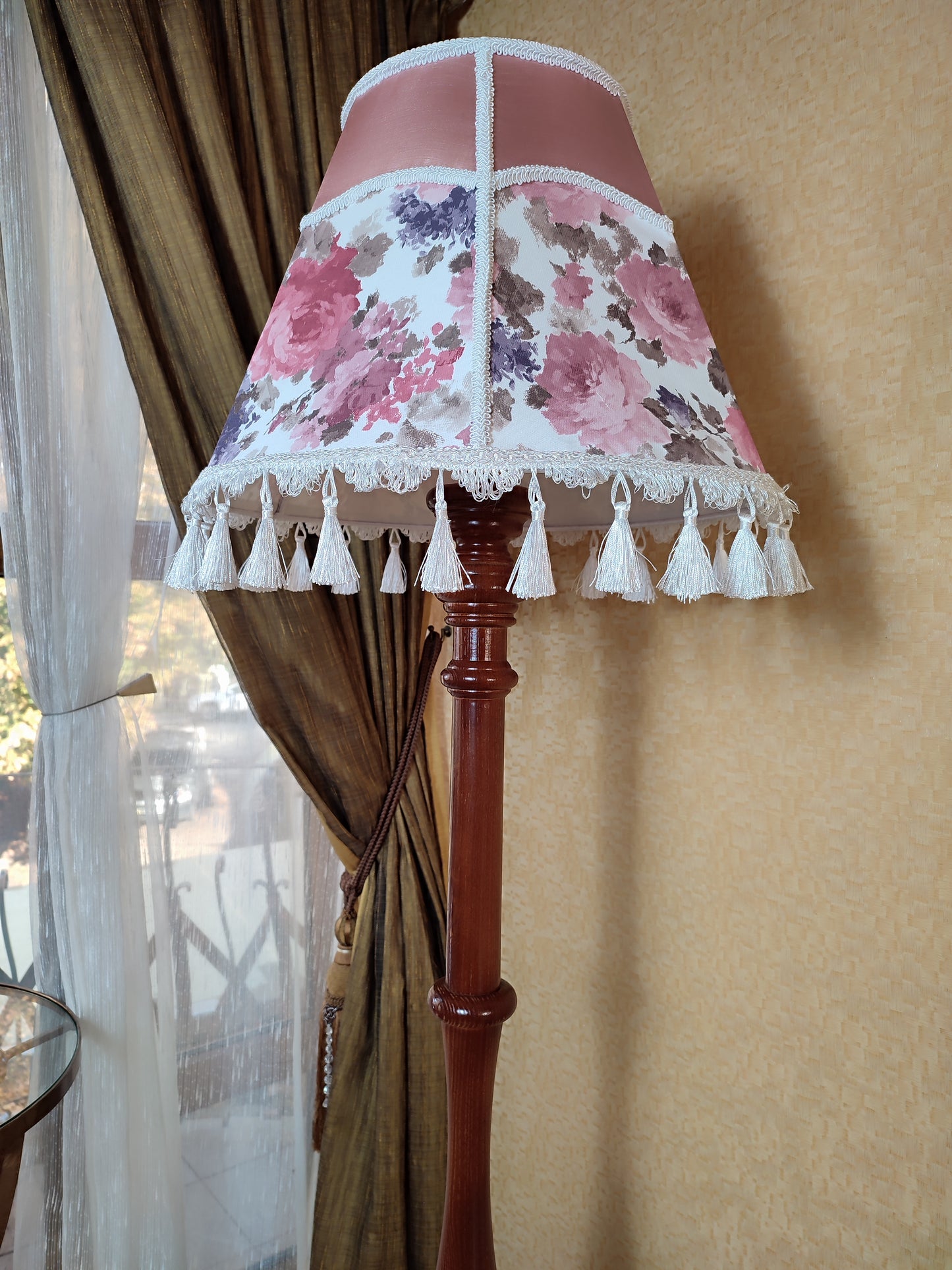 Floor lamp, pastel pink top, blooming flower shade, delicate fringe with tassels, on an elegant wooden base. 3601