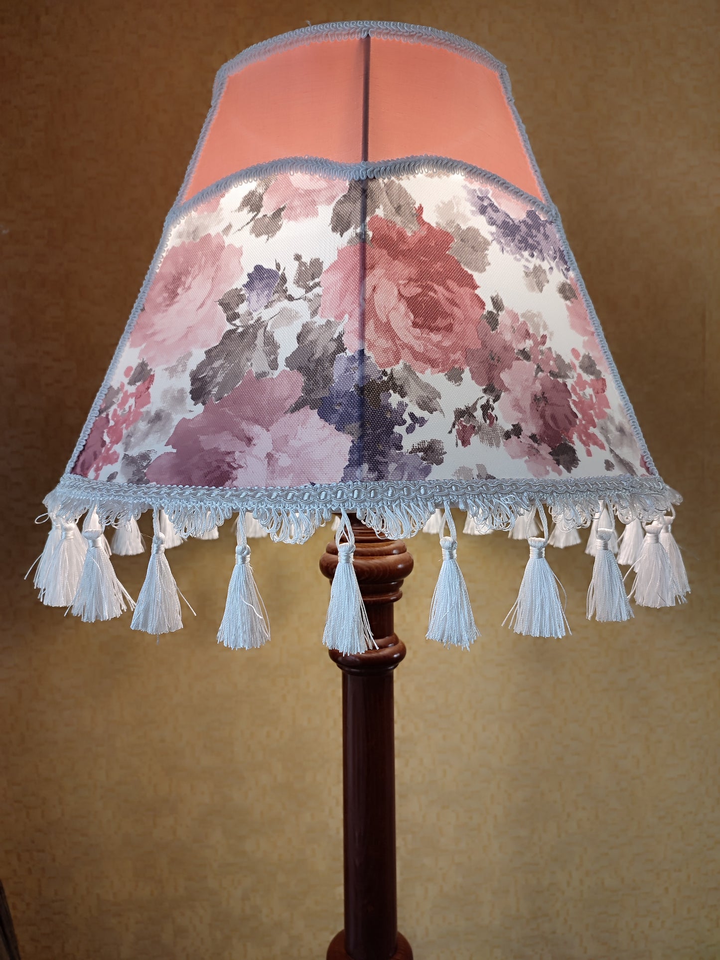 Floor lamp, pastel pink top, blooming flower shade, delicate fringe with tassels, on an elegant wooden base. 3601