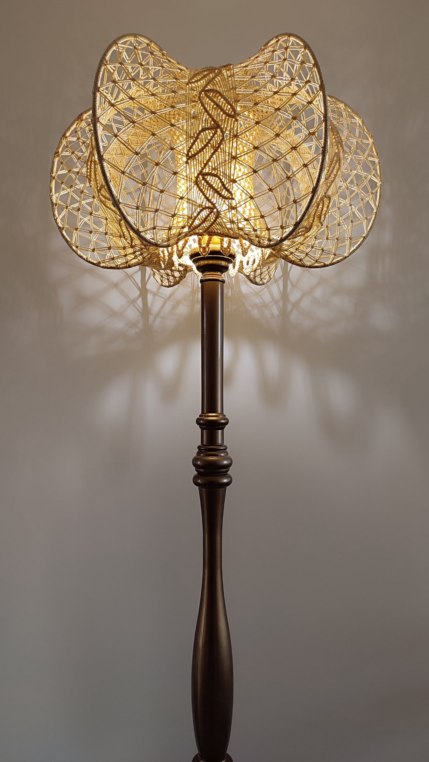 A unique macrame lampshade with a complex panel design. 2207