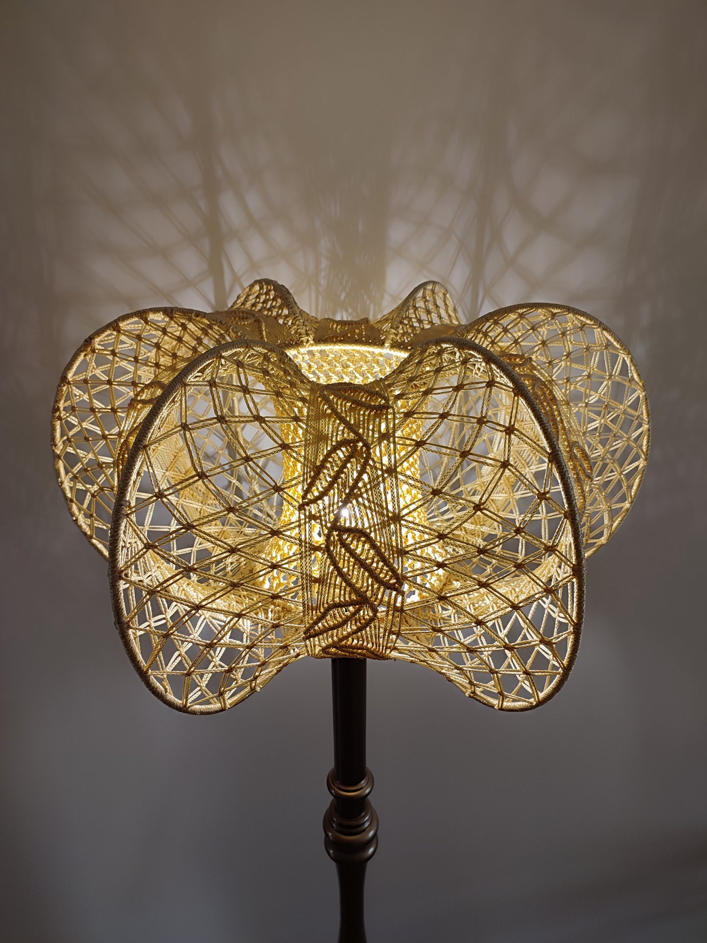 A unique macrame lampshade with a complex panel design. 2207