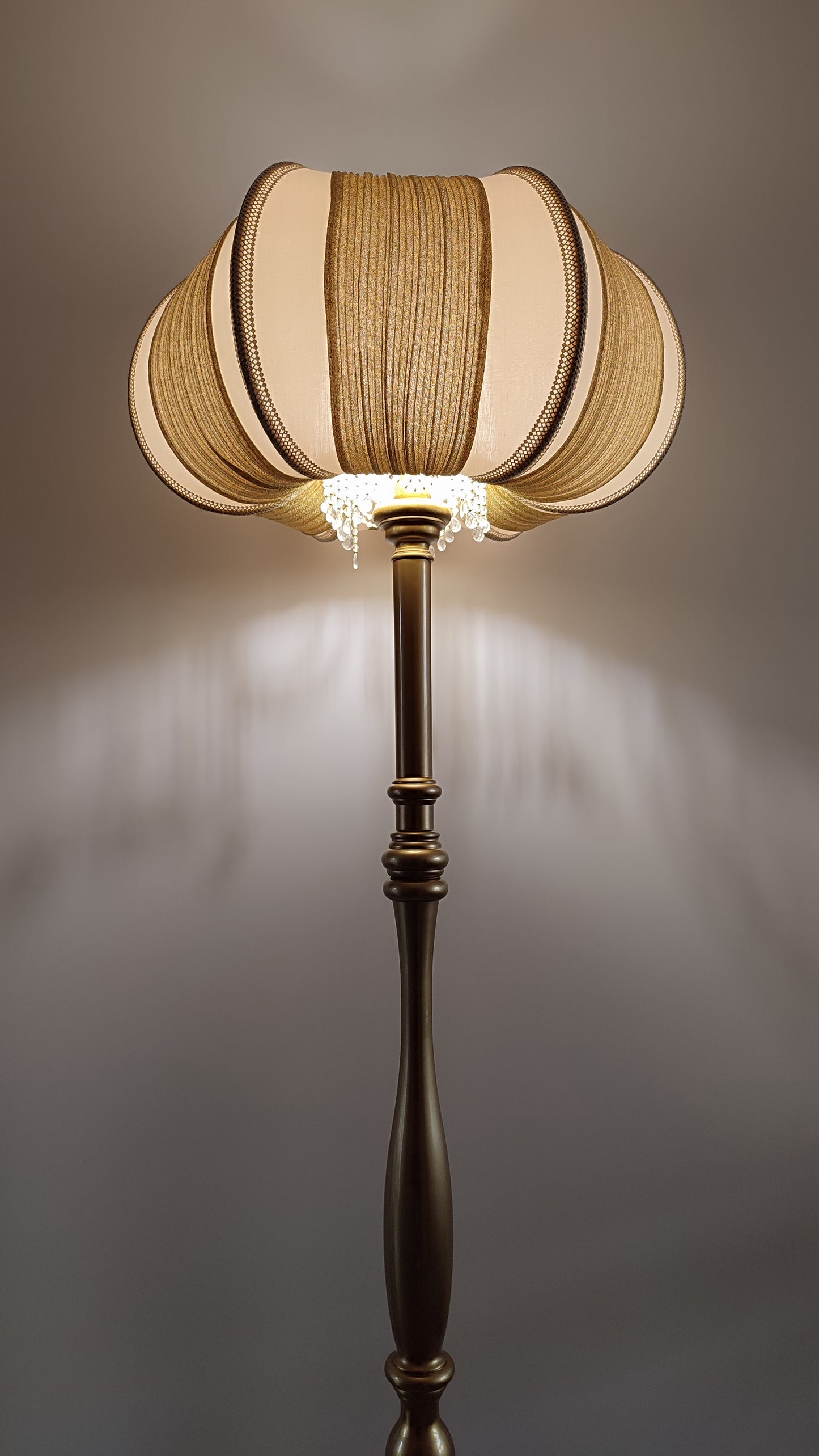 A two-tone creamy golden lampshade, delicate crystal beads and an elegant wooden base add a touch of luxurious radiance 2206