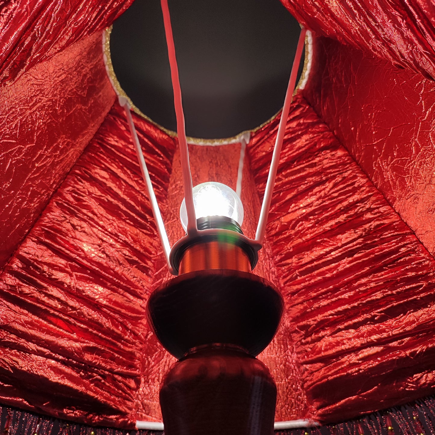 A burgundy lampshade with a swirling pattern and beaded fringe.Unique lamp, handcrafted laтббmp, decorative lamp. 1116