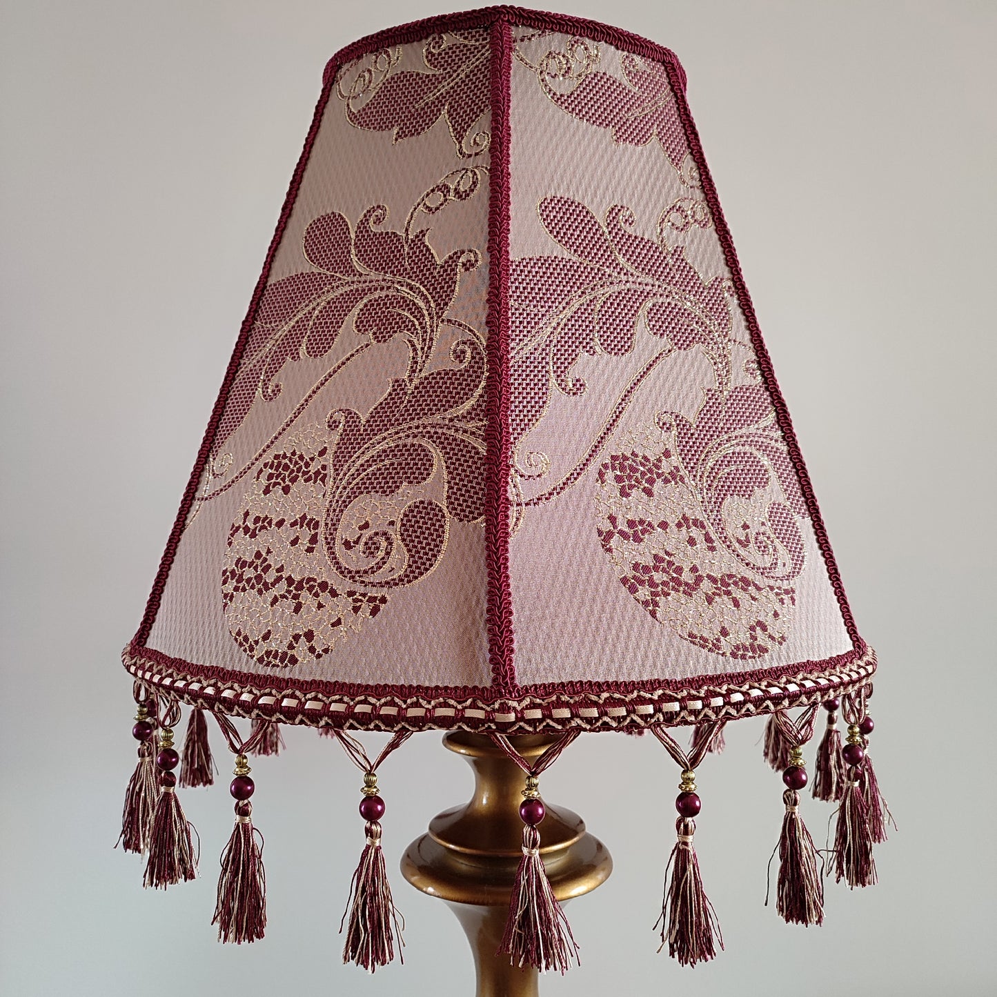 Retro burgundy lampshade with an elegant tassel and beaded details. 4503