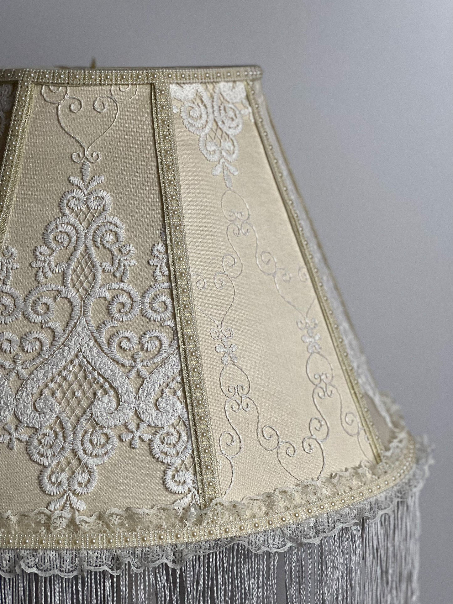Victorian lampshade. Cream patterned lampshade with long fringe. 1106