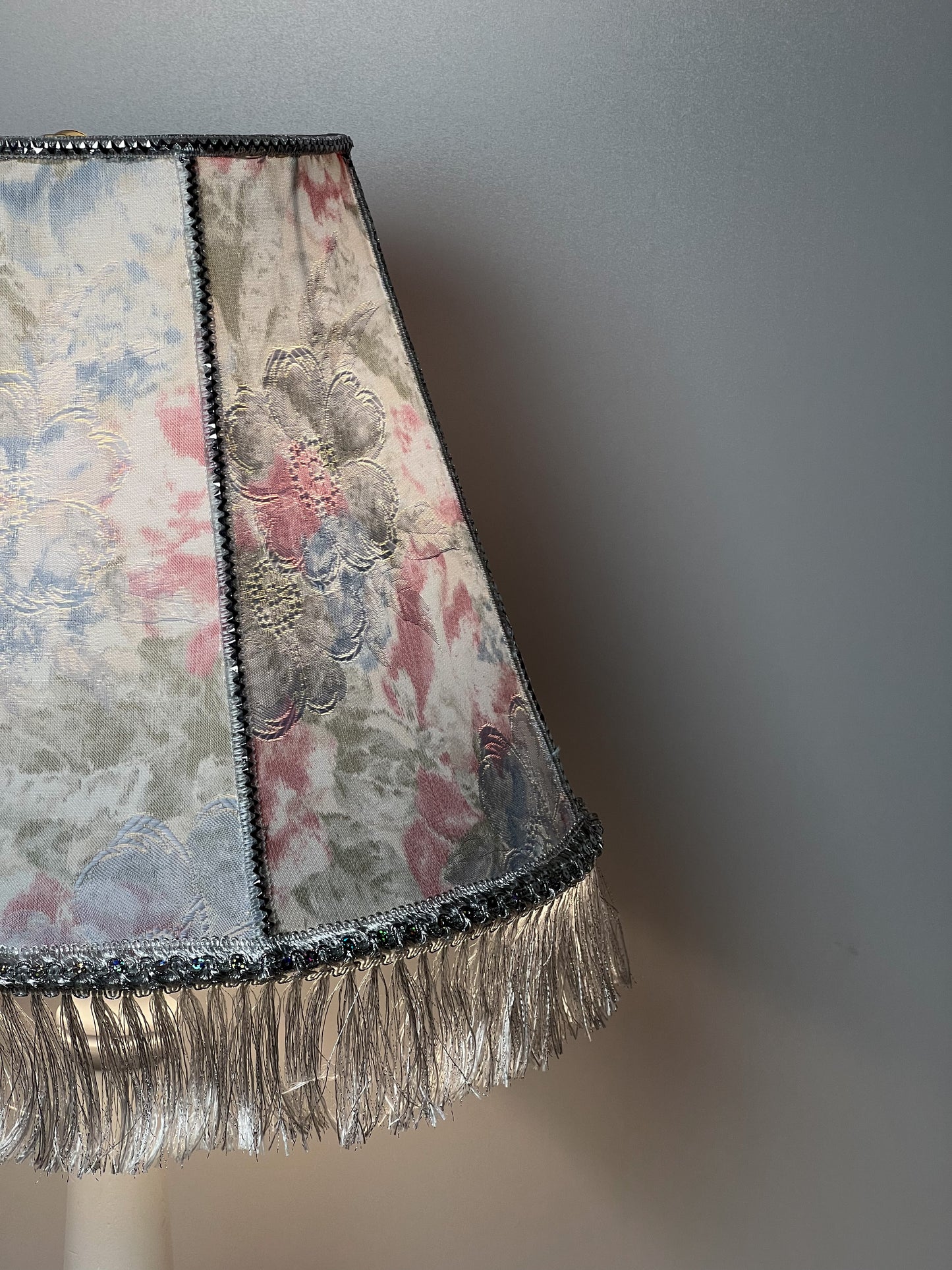 Floral lampshade with embossed patterned fabric and fringe. 0203