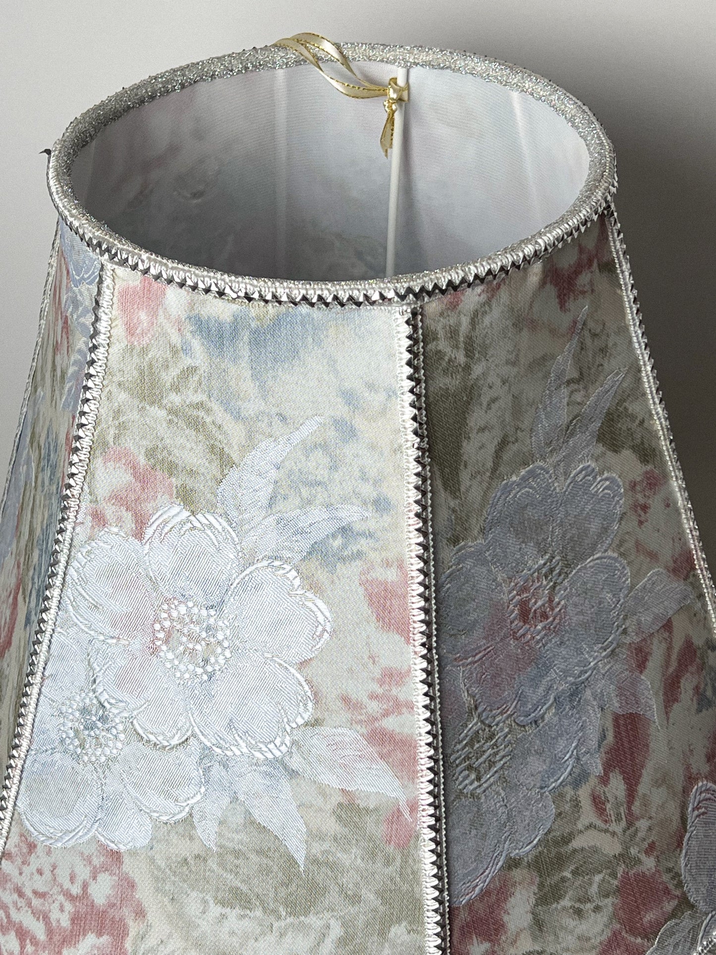 Floral lampshade with embossed patterned fabric and fringe. 0203
