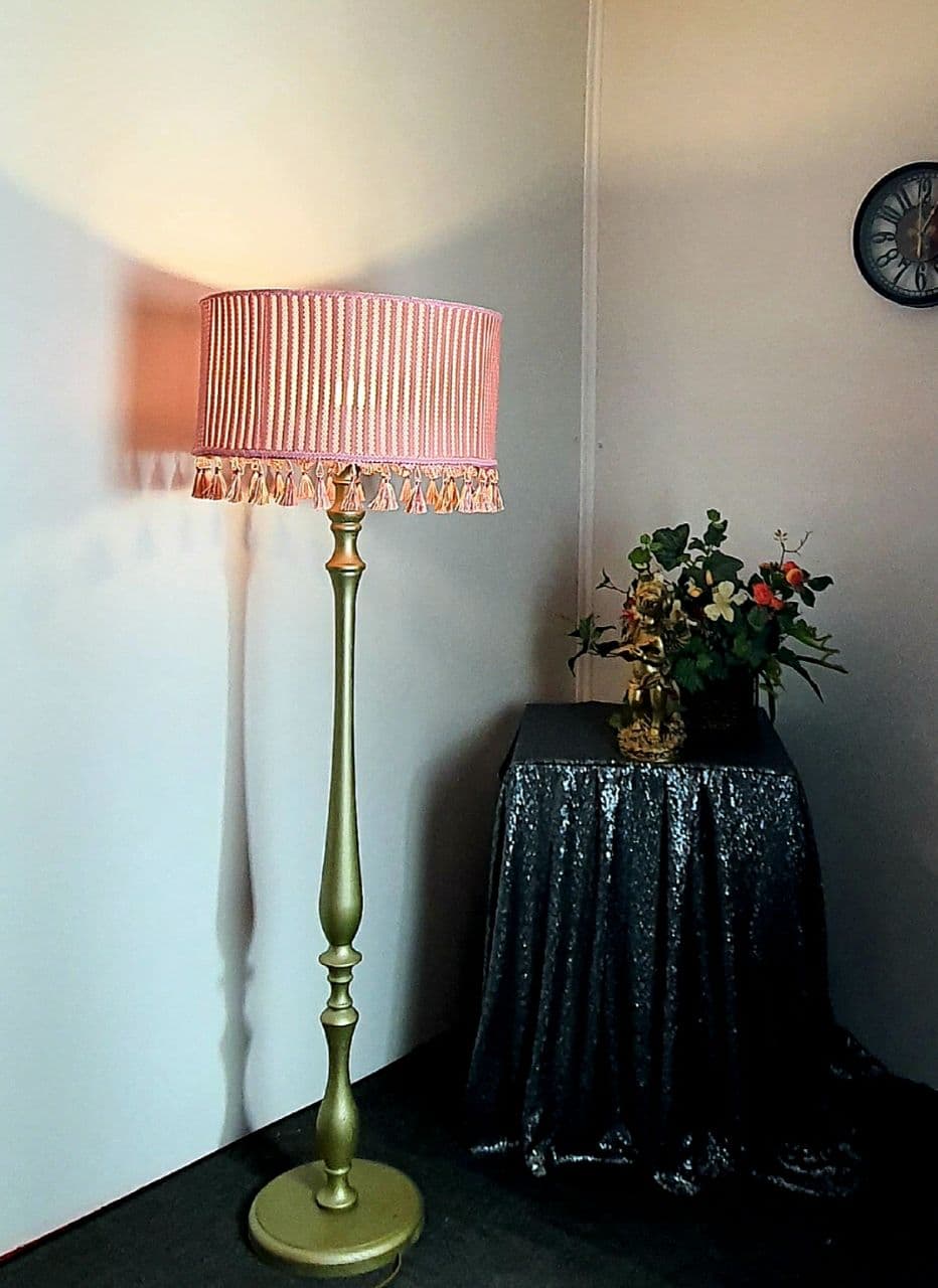 Pink fabric lampshade with embossed surface.