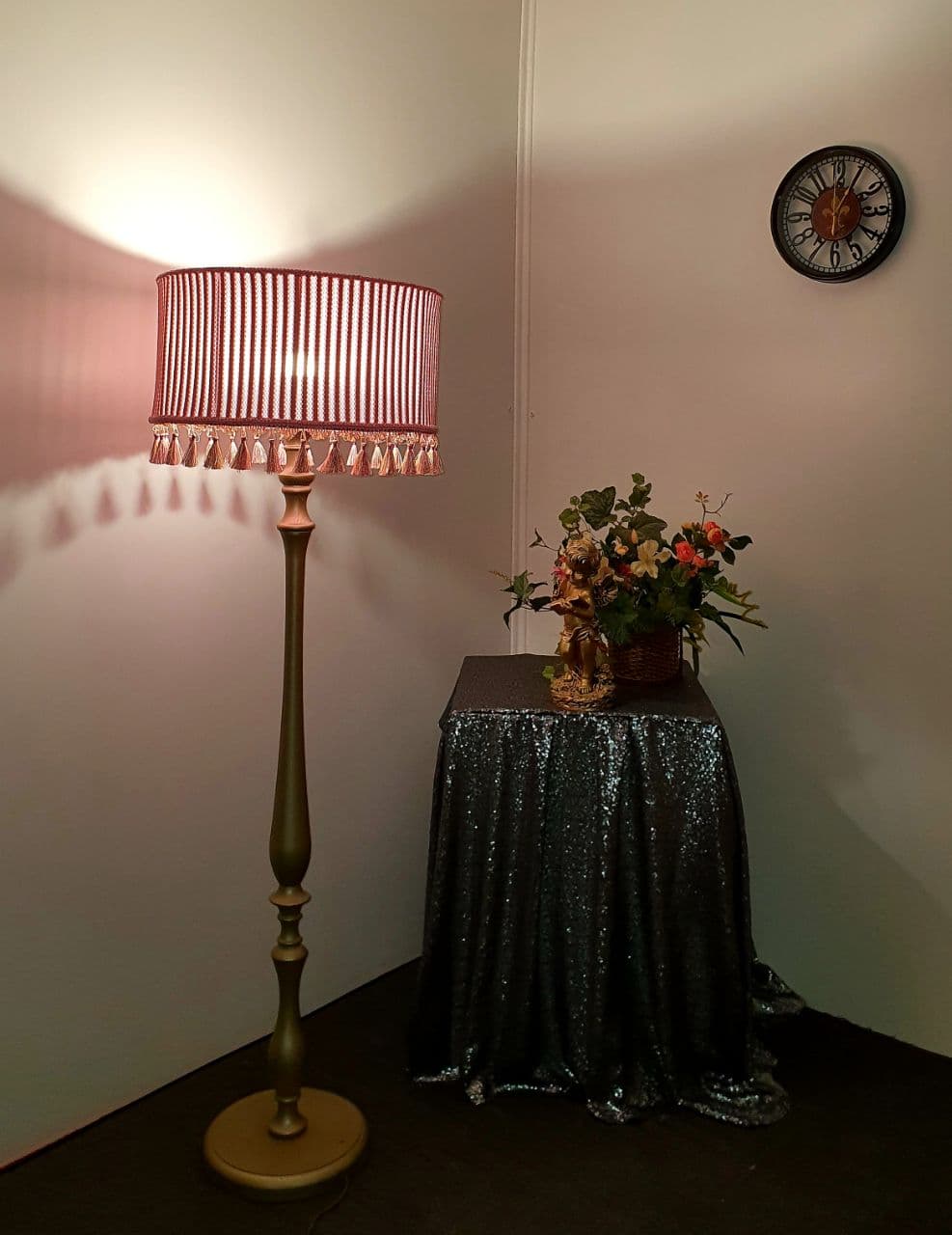 Pink fabric lampshade with embossed surface.
