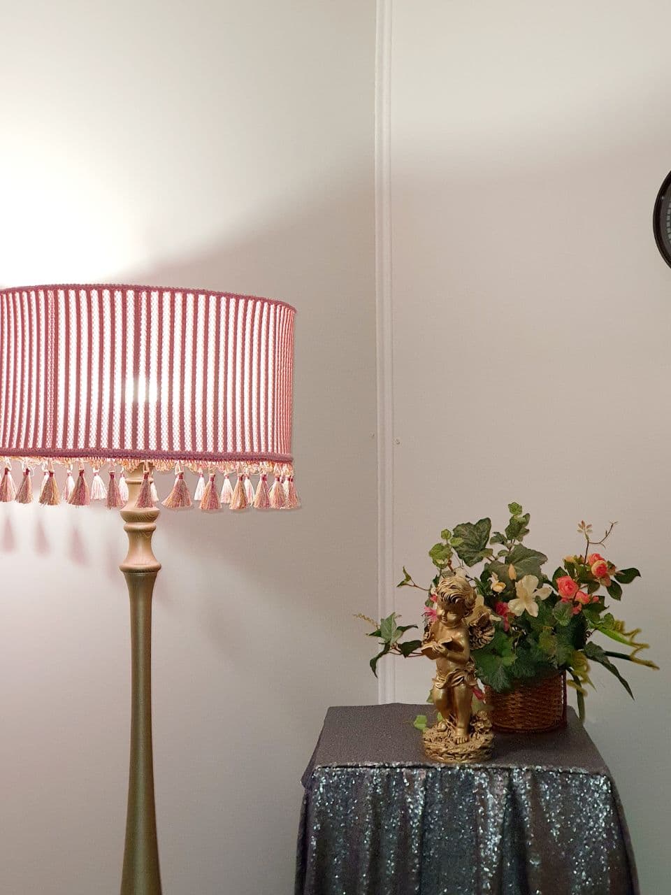 Pink fabric lampshade with embossed surface.