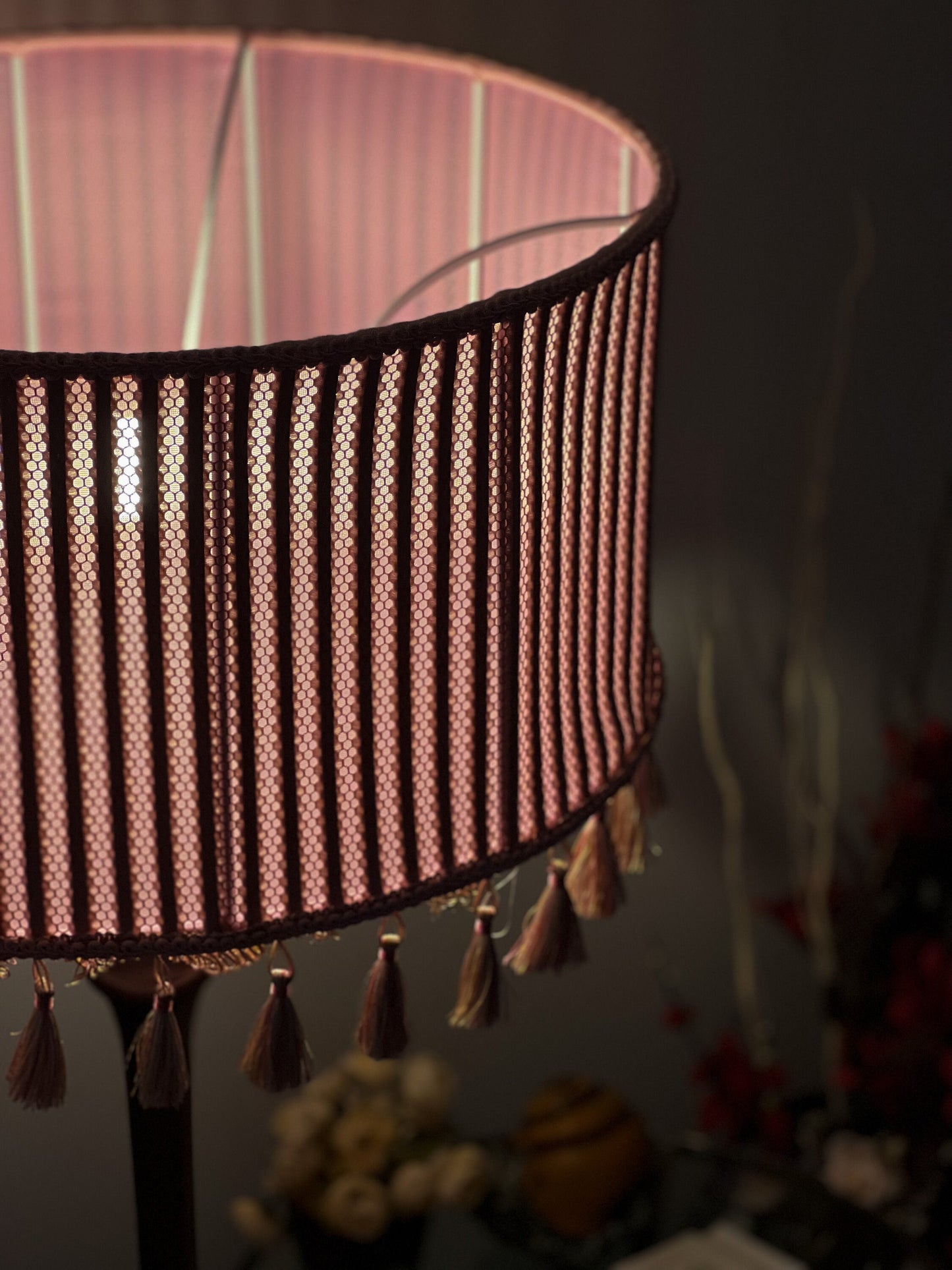 Pink fabric lampshade with embossed surface.