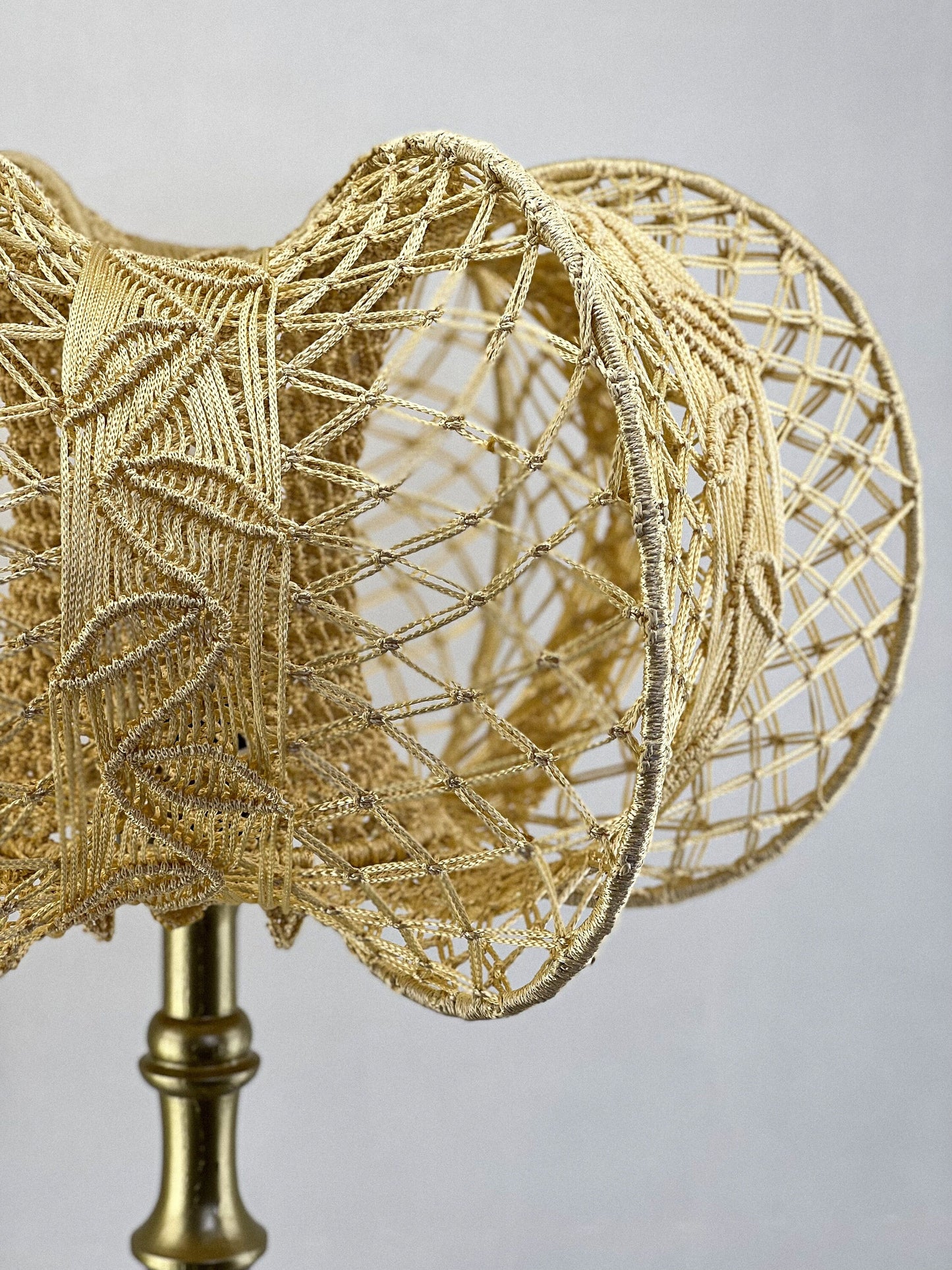 A unique macrame lampshade with a complex panel design. 2207