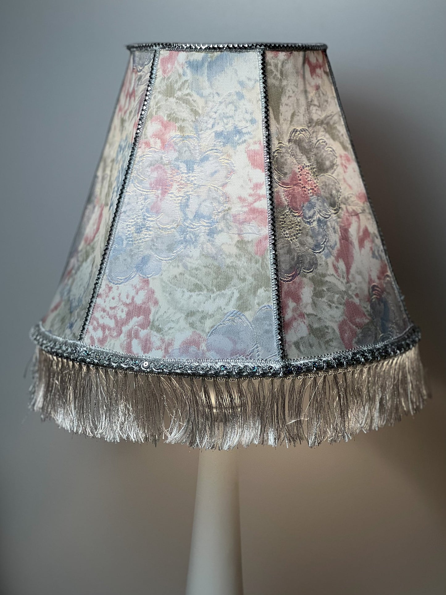 Floral lampshade with embossed patterned fabric and fringe. 0203