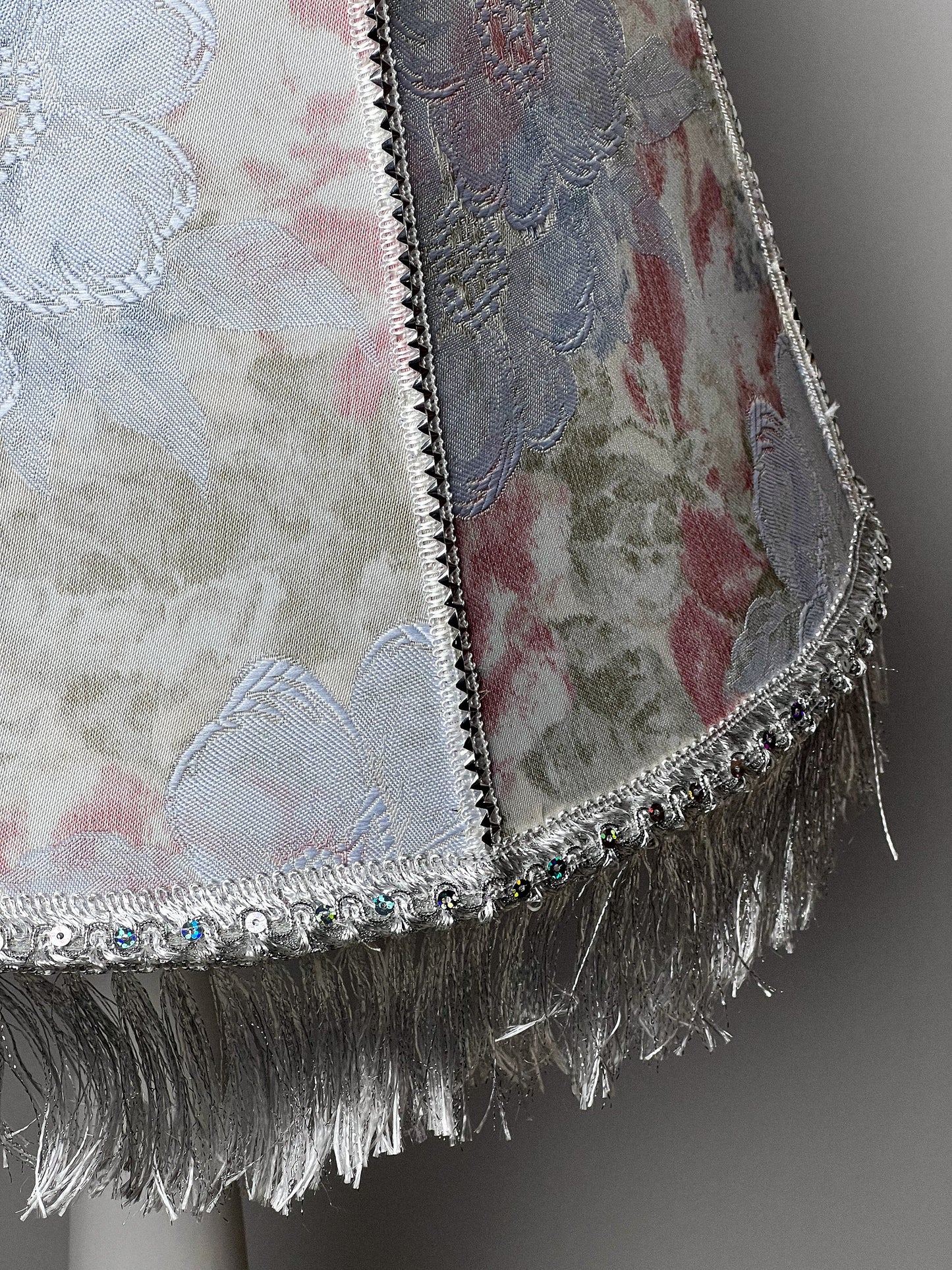 Floral lampshade with embossed patterned fabric and fringe. 0203