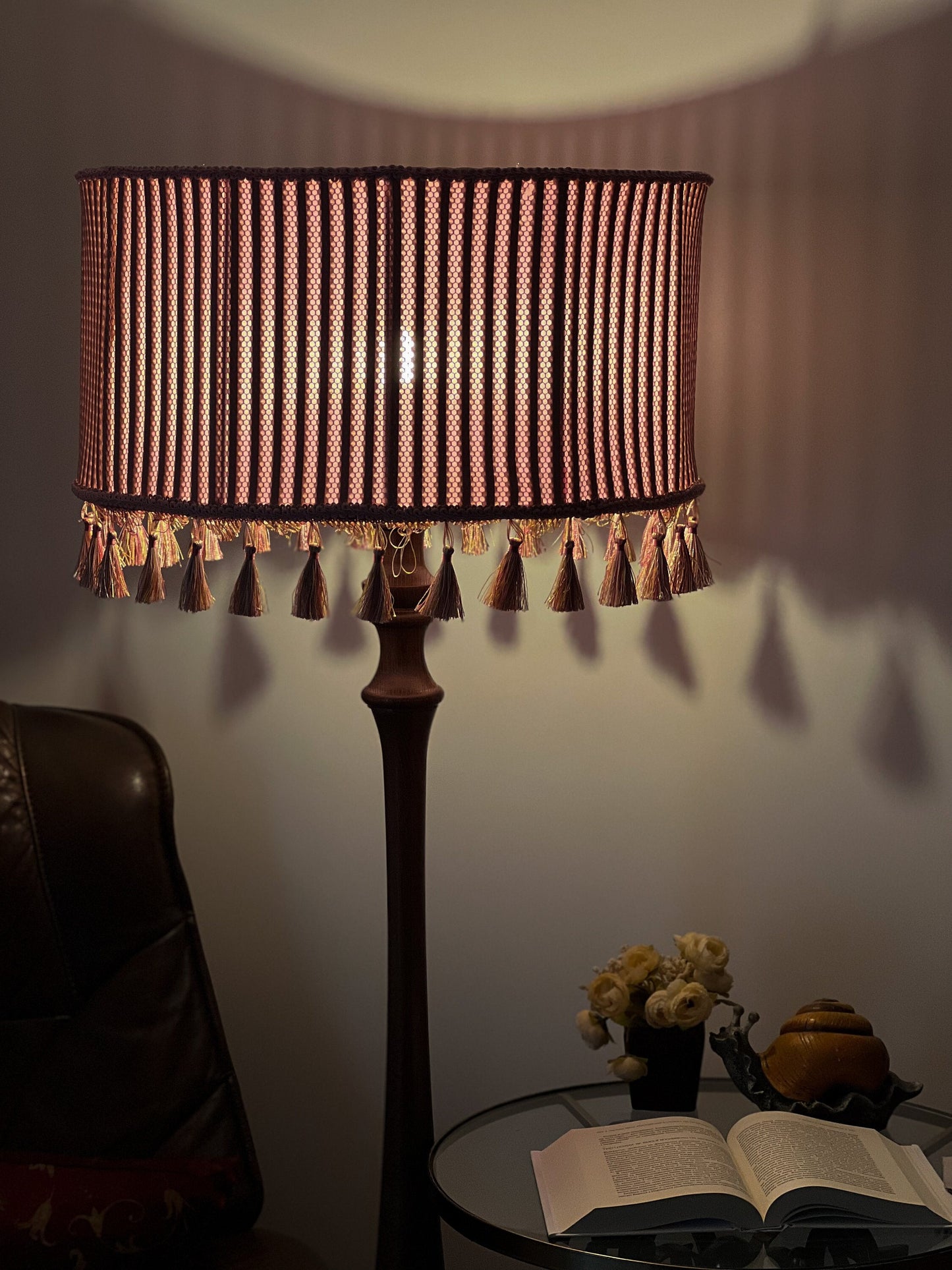 Pink fabric lampshade with embossed surface.