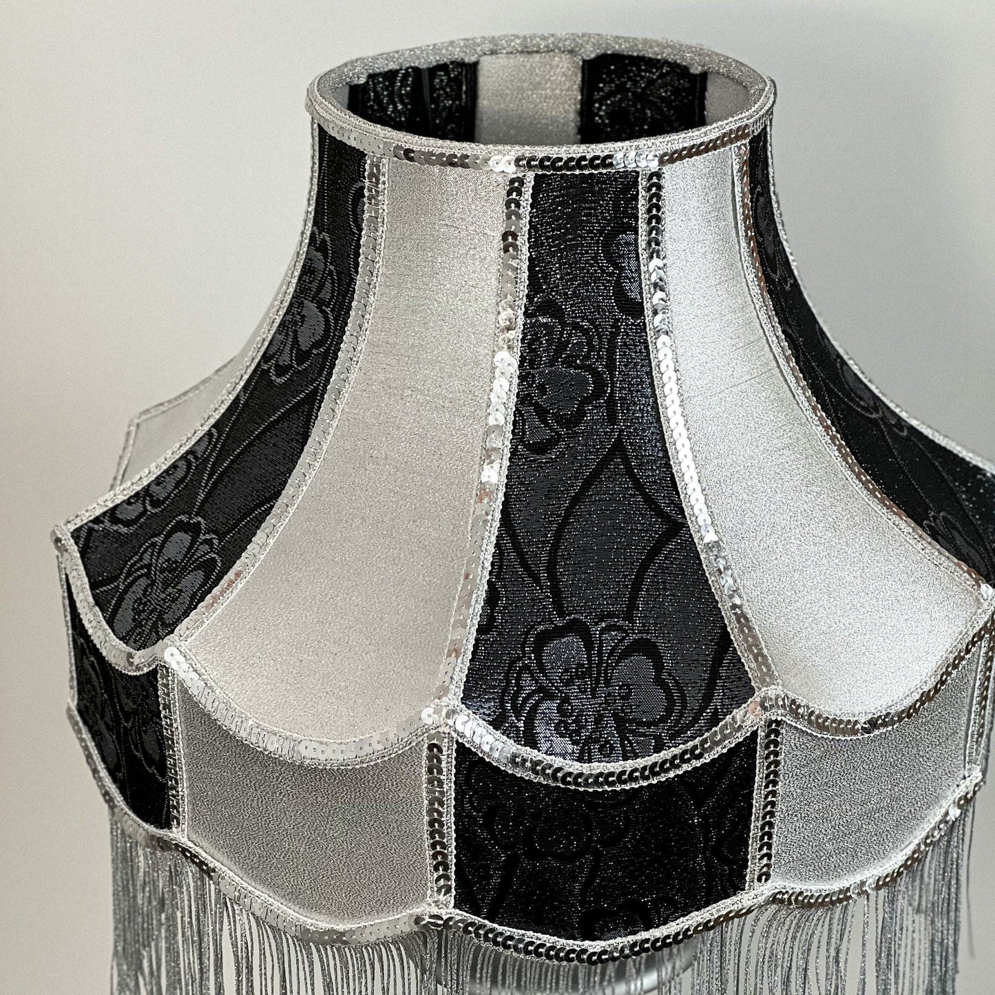 Luxurious Victorian table lamp with sequins and fringe.