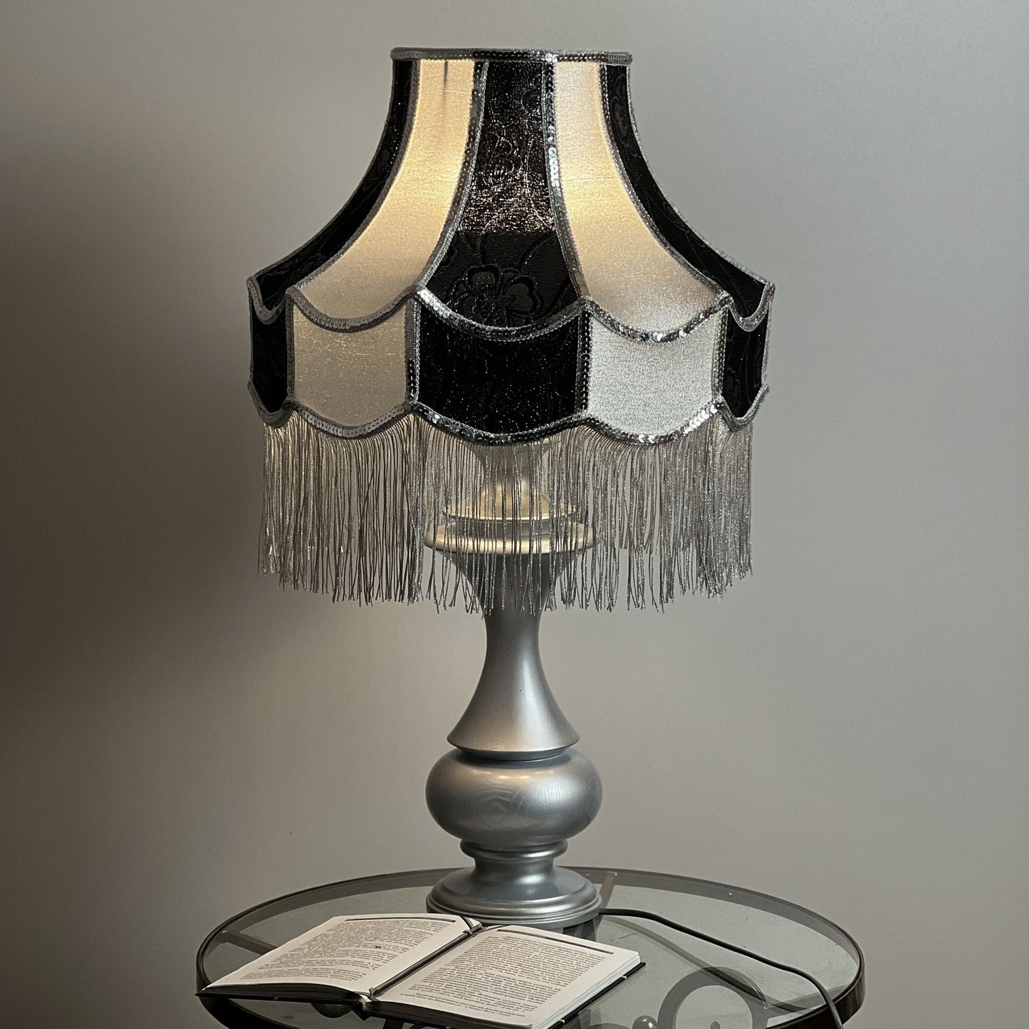 Luxurious Victorian table lamp with sequins and fringe.
