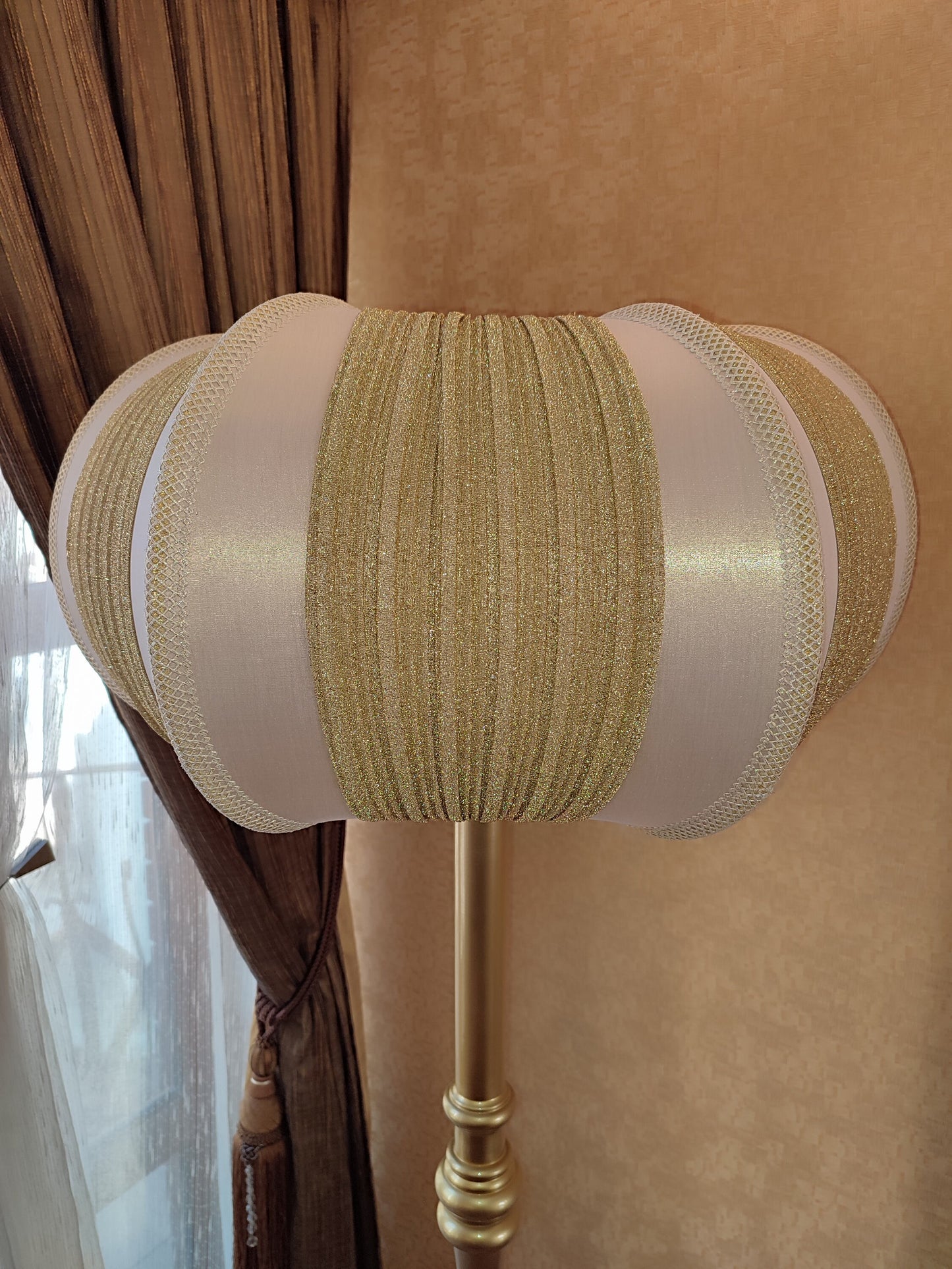 A two-tone creamy golden lampshade, delicate crystal beads and an elegant wooden base add a touch of luxurious radiance 2206