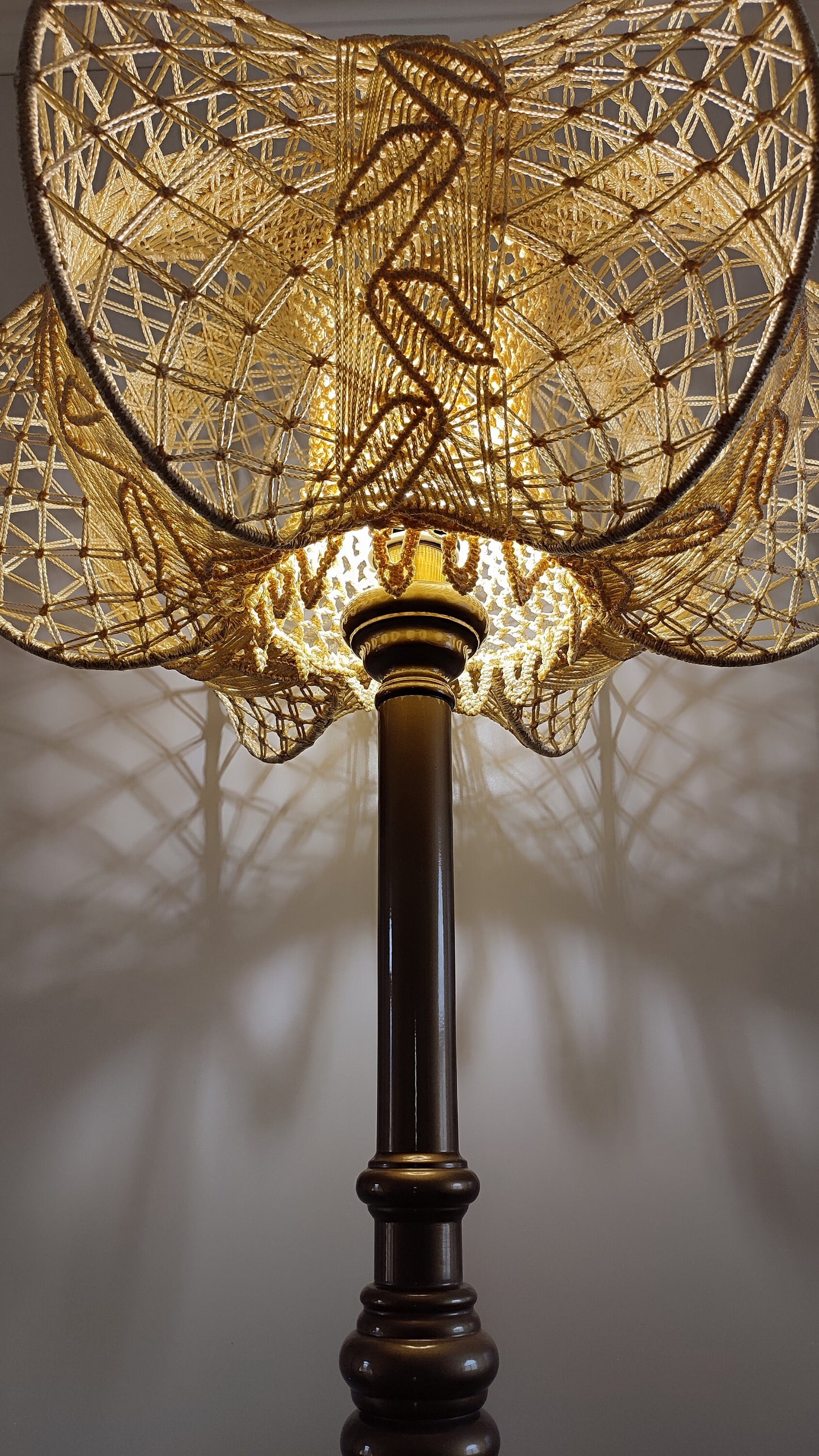 A unique macrame lampshade with a complex panel design. 2207
