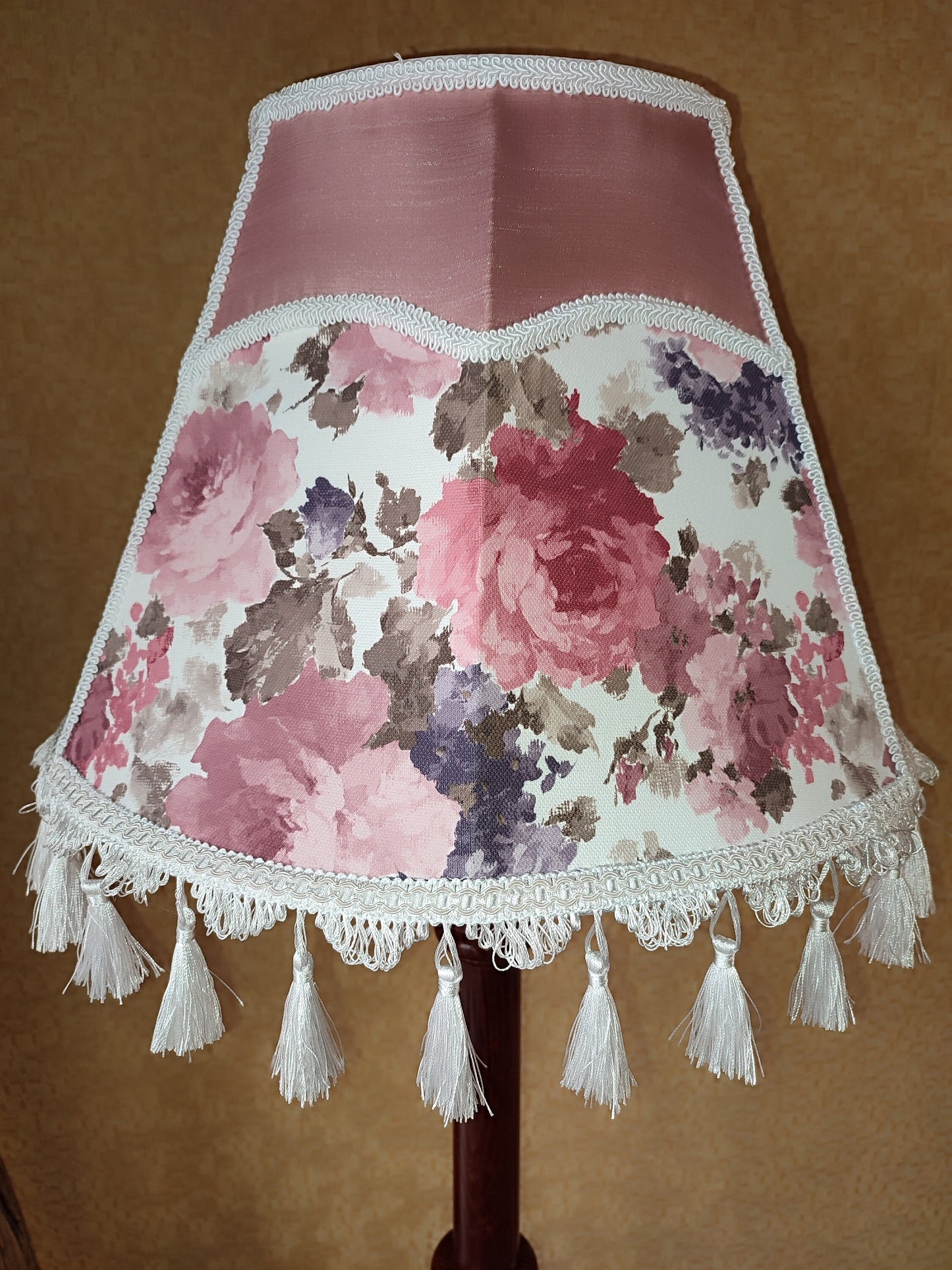 Floor lamp, pastel pink top, blooming flower shade, delicate fringe with tassels, on an elegant wooden base. 3601