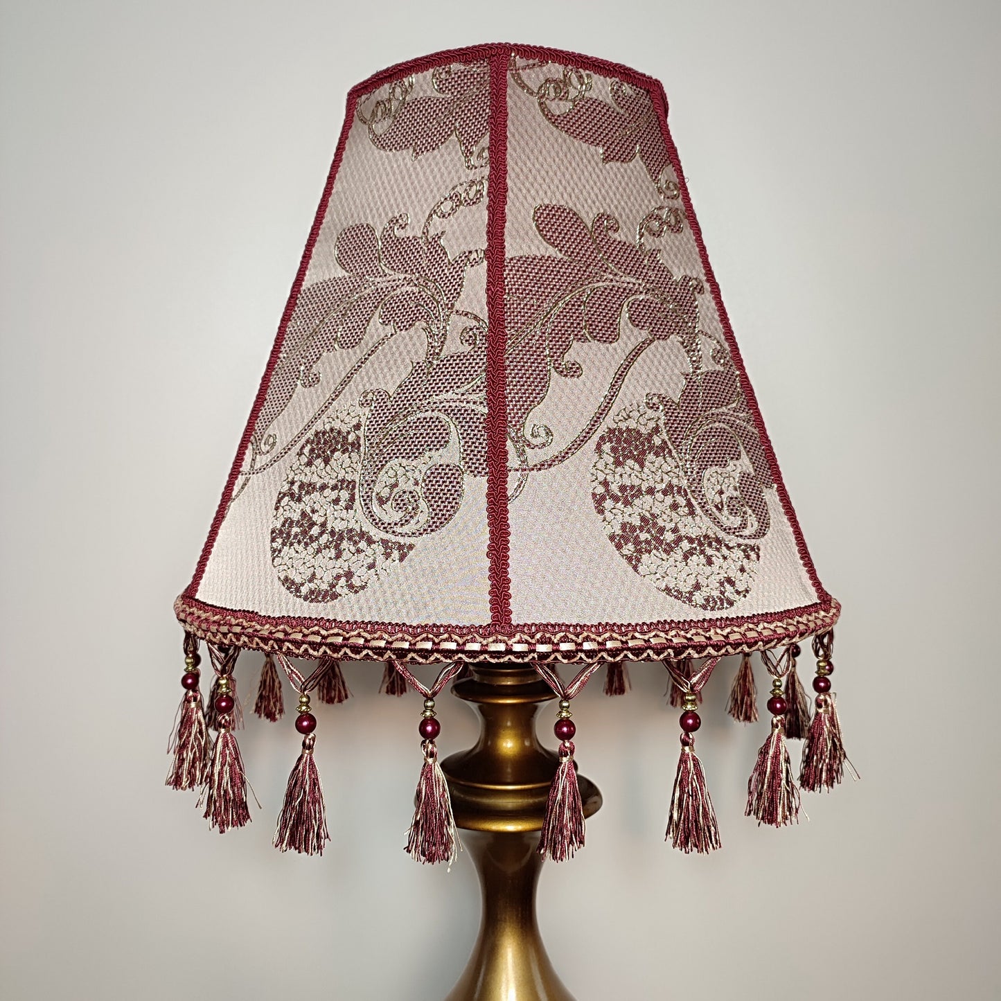 Retro burgundy lampshade with an elegant tassel and beaded details. 4503