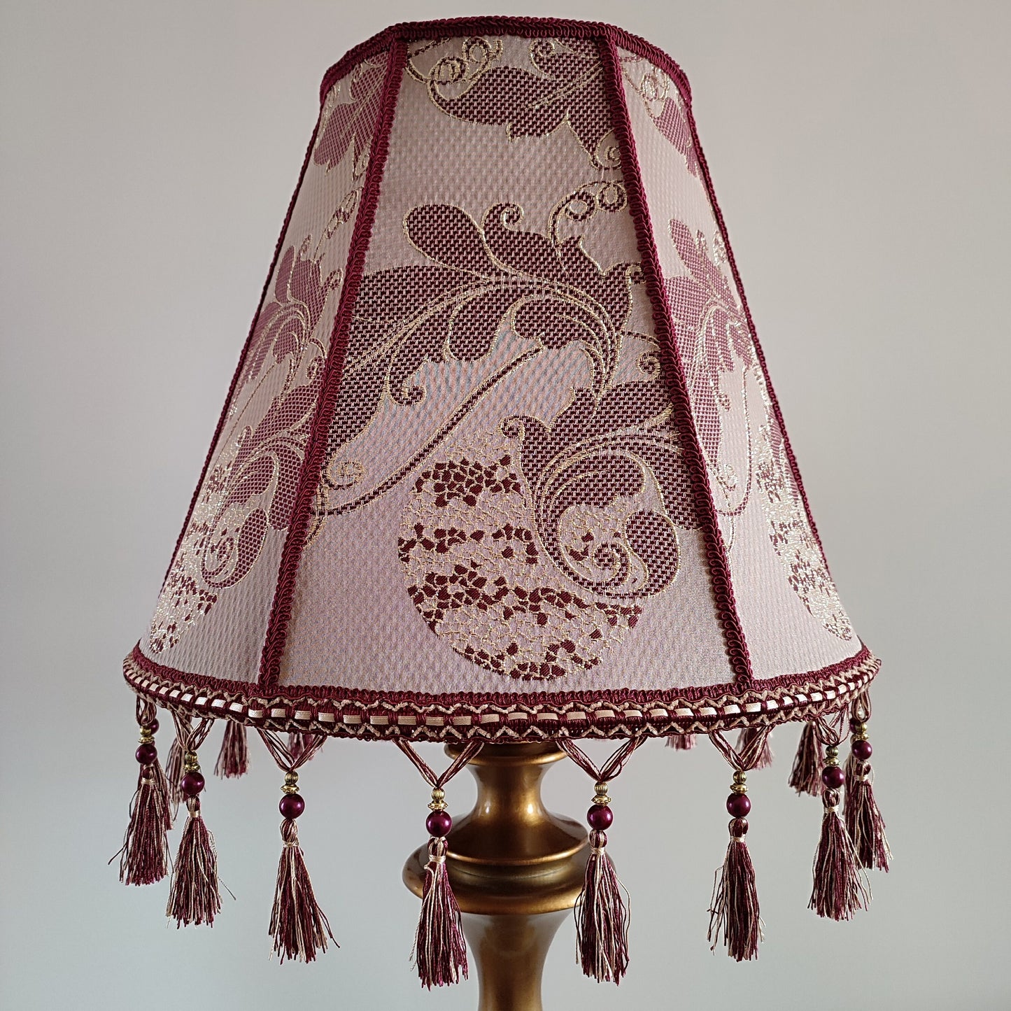 Retro burgundy lampshade with an elegant tassel and beaded details. 4503