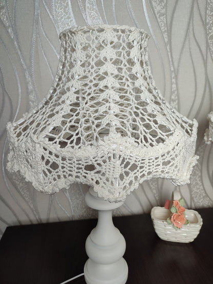 Table lamp, bedside. A chic table lamp in pastel white color with a delicate lace shade. 1301