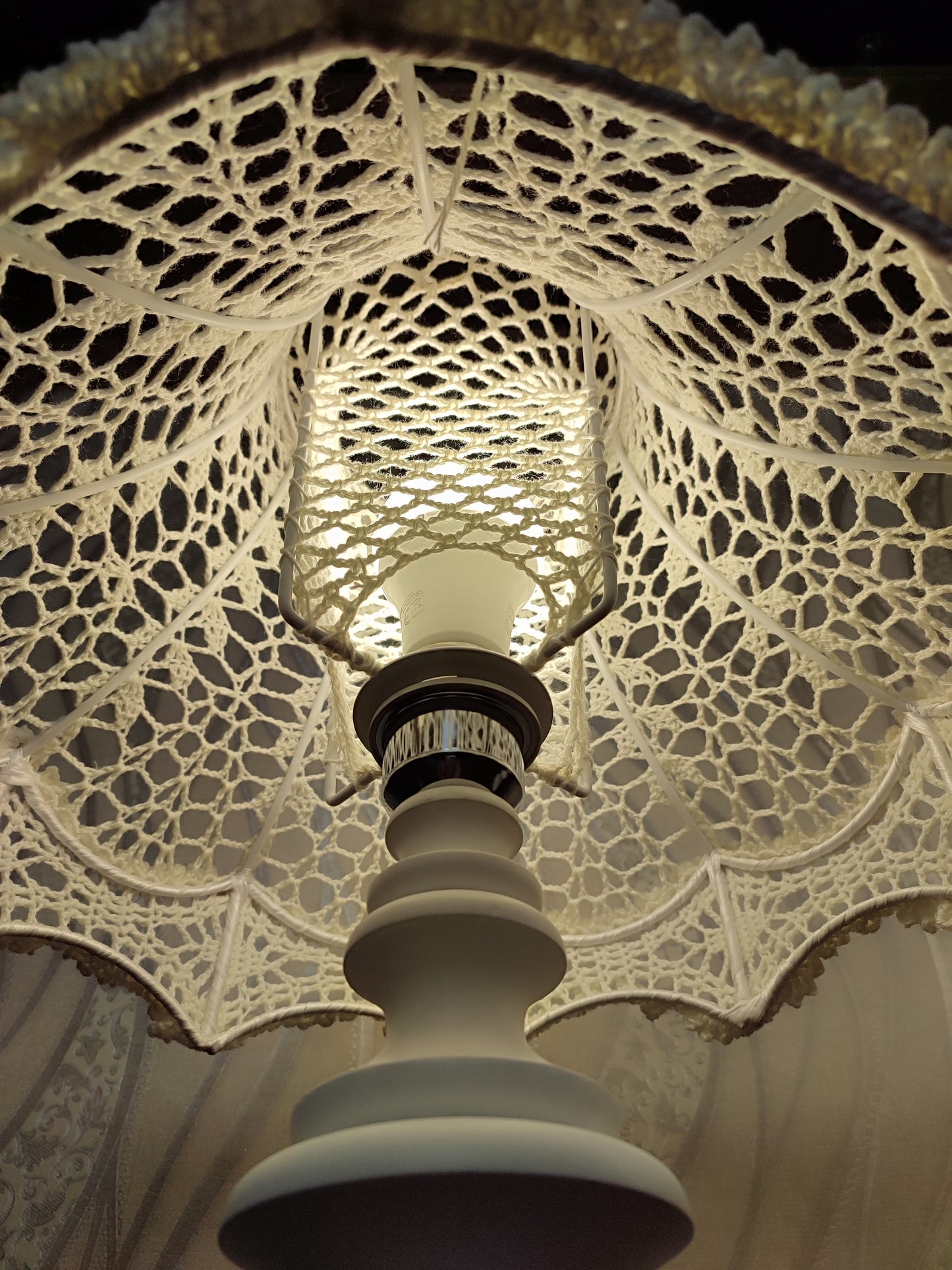 Table lamp, bedside. A chic table lamp in pastel white color with a delicate lace shade. 1301