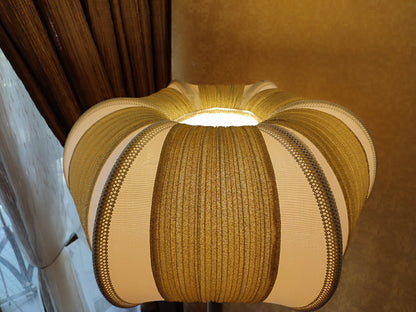 A two-tone creamy golden lampshade, delicate crystal beads and an elegant wooden base add a touch of luxurious radiance 2206