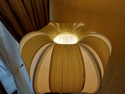 A two-tone creamy golden lampshade, delicate crystal beads and an elegant wooden base add a touch of luxurious radiance 2206