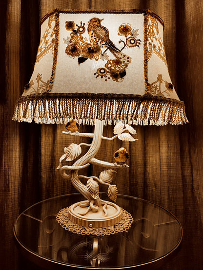 Lampshade. A unique lampshade with an embroidered bird and crocheted flowers.