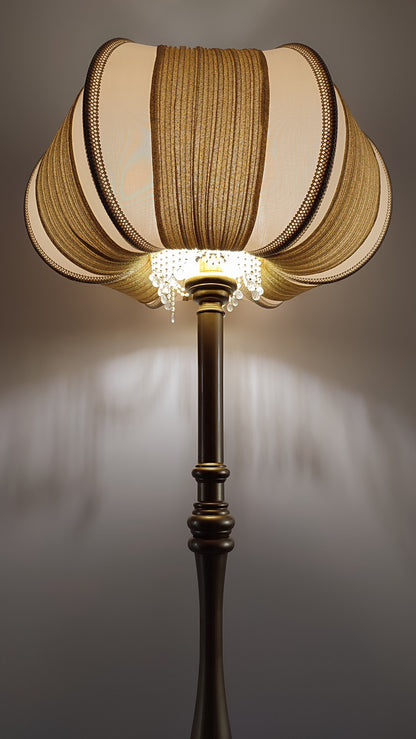 A two-tone creamy golden lampshade, delicate crystal beads and an elegant wooden base add a touch of luxurious radiance 2206