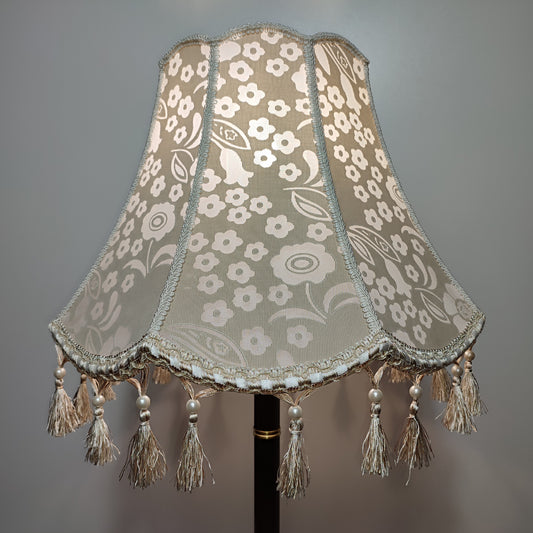 Handmade beige lampshade with beads and fringe featuring a floral pattern. № 2002