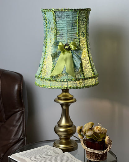 A unique lampshade. A fabulous light green lampshade with guipure and textiles for a table lamp. 0401