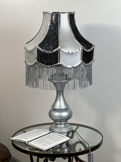 Luxurious Victorian table lamp with sequins and fringe.