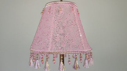 A pink handmade lampshade made of guipure lace, adorned with rhinestones and beaded fringe. № 0504
