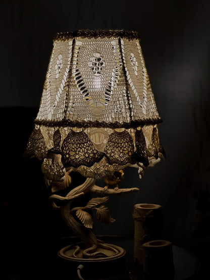 Victorian crochet table lamp with artistic wrought iron base