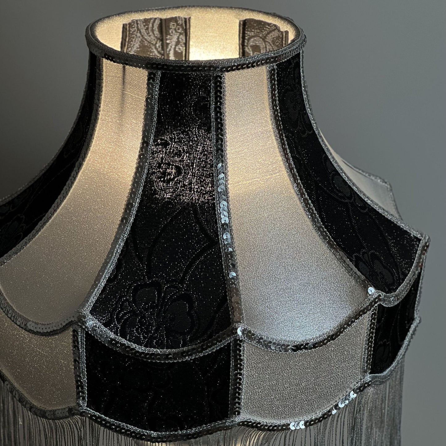 Luxurious Victorian table lamp with sequins and fringe.
