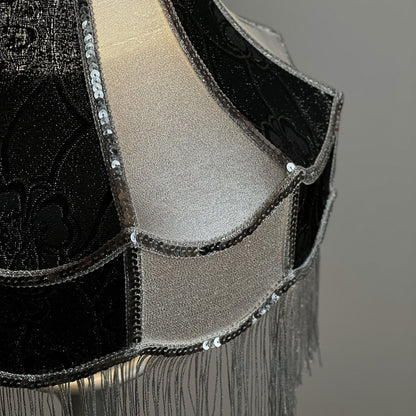 Luxurious Victorian table lamp with sequins and fringe.