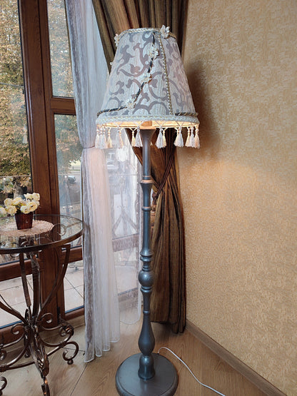 Floor lamp with an exquisite Victorian shade decorated with elegant tassels